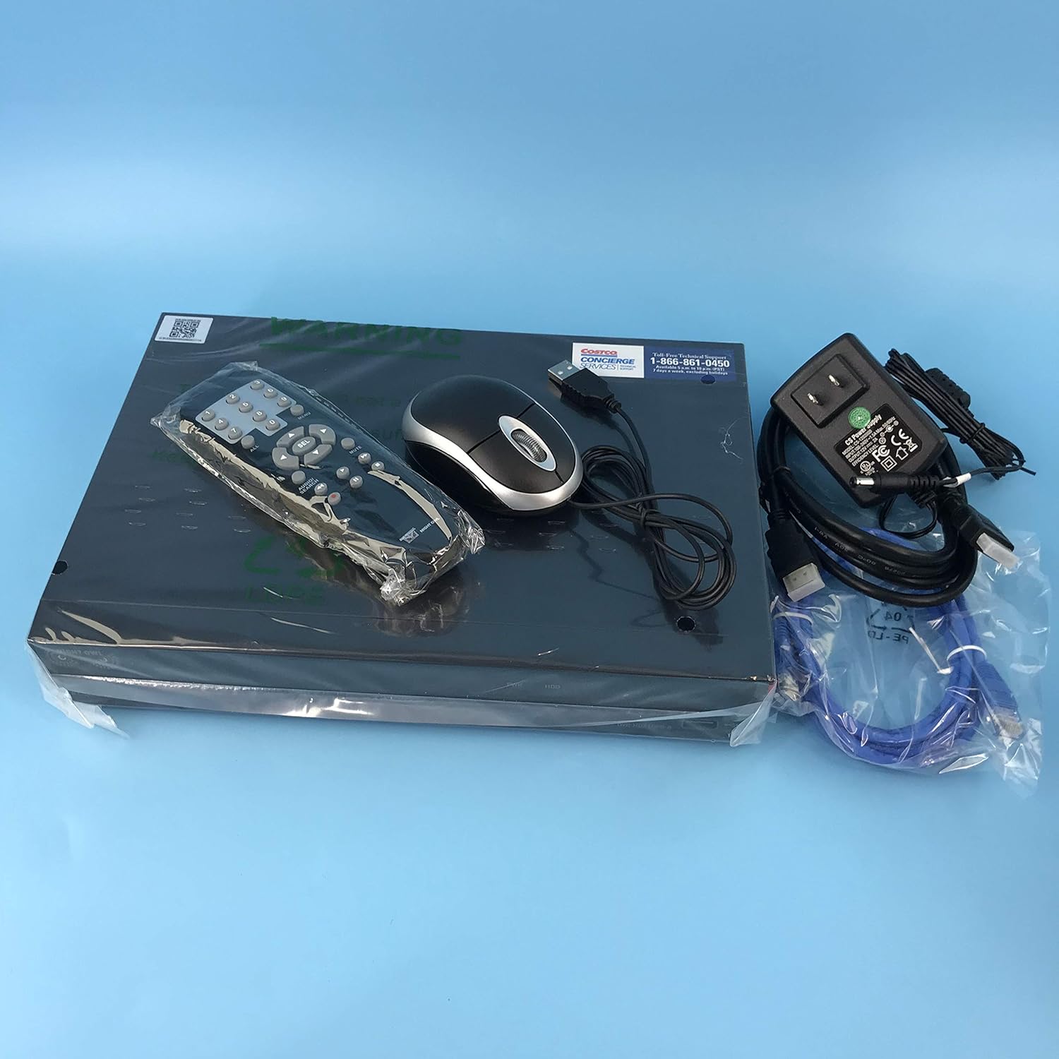DVR, remote control, mouse, and power adapter