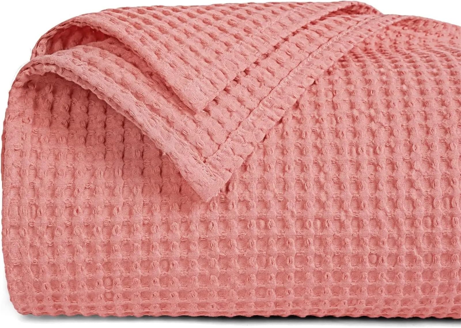 Manta de tejido gofre ideal para la siesta de verano en el sofá