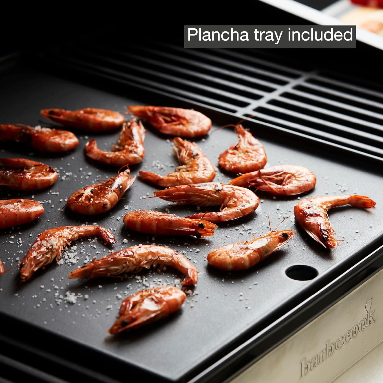 Close-up of shrimp cooking on the Barbecook Stella 4311's plancha tray.