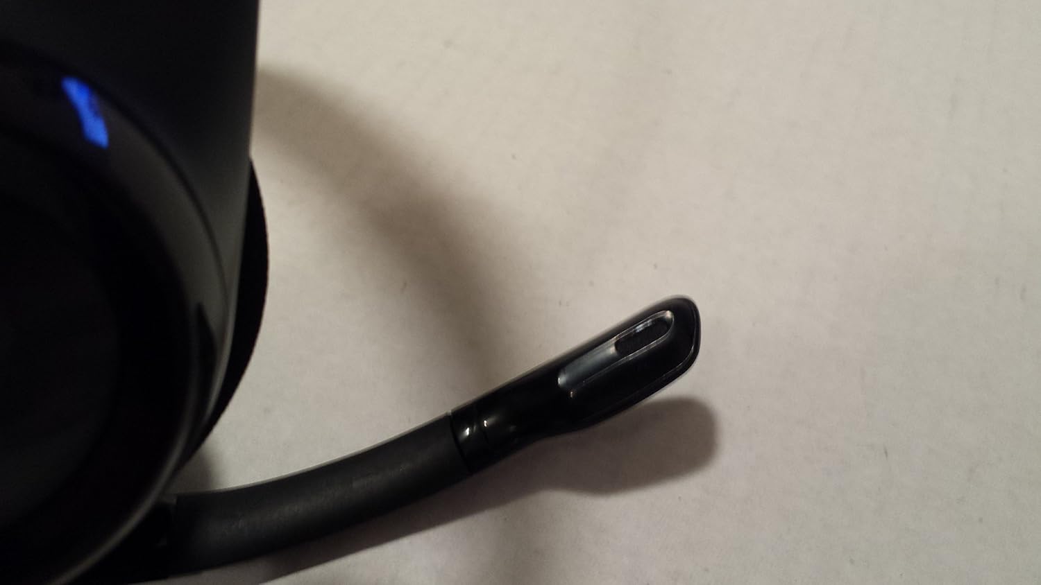 Close-up of the flexible boom microphone tip on the Logitech ClearChat Pro USB Headset.