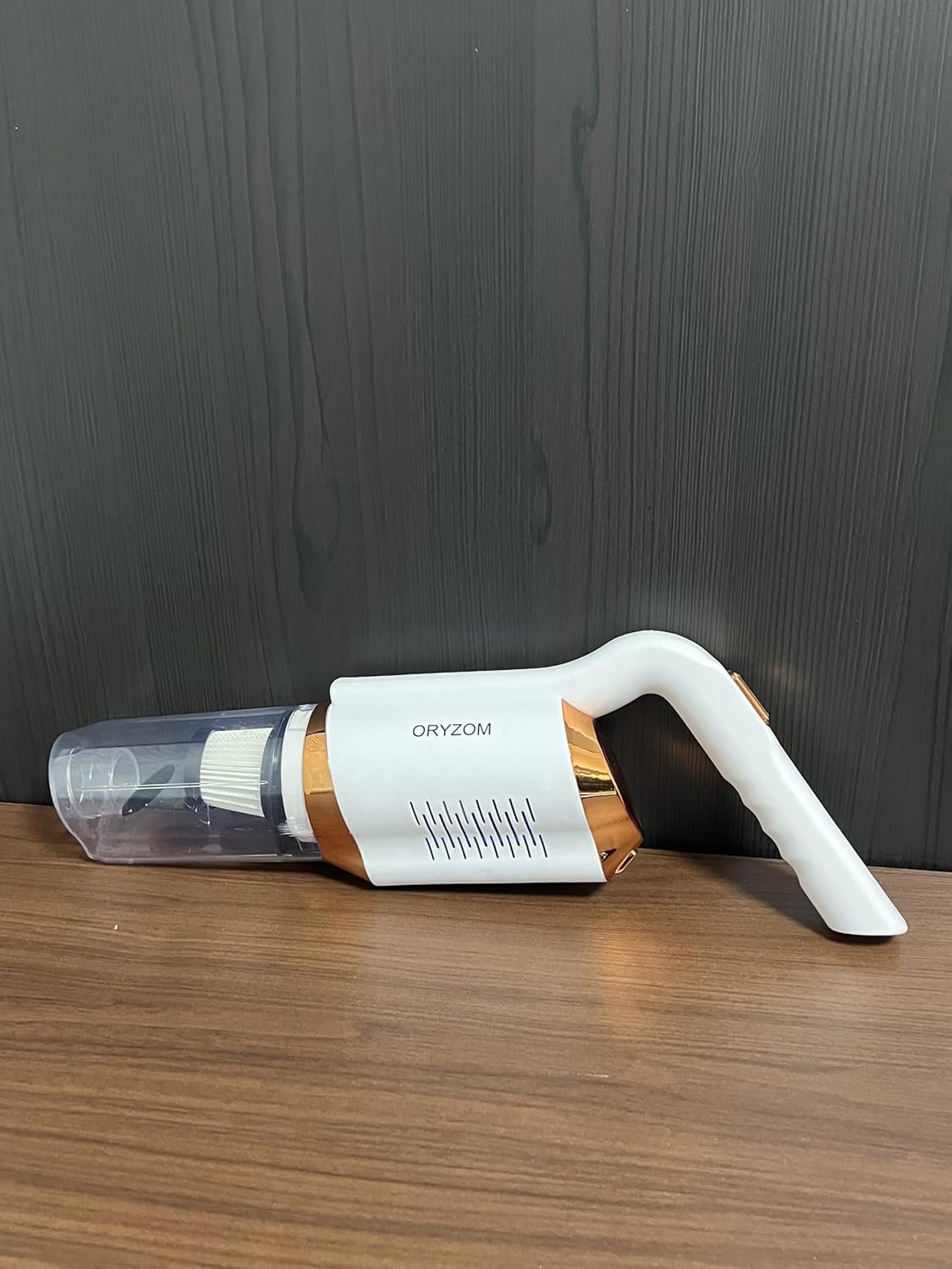 Side view of the ORYZOM Handheld Vacuum Cleaner with nozzle attached
