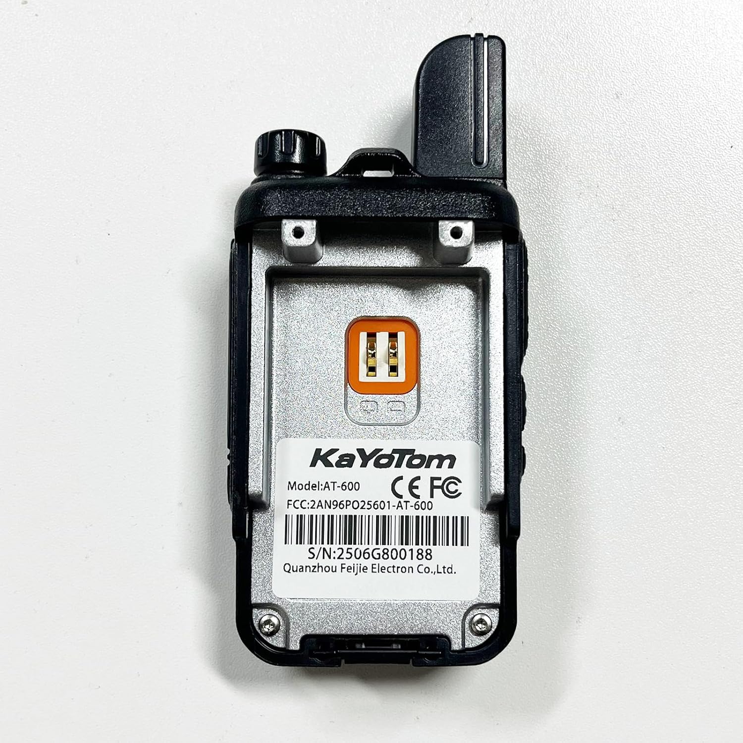 Back view of the KAYOTOM AT-600 walkie talkie showing model number and FCC ID