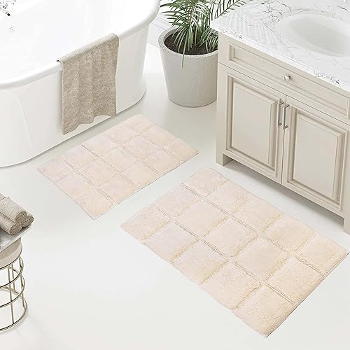 Superior Juego de alfombras de baño antideslizantes de algodón con respaldo de látex en aerosol, 20 x 30 pulgadas, 24 x 36 pulgadas, 2 piezas, marfil