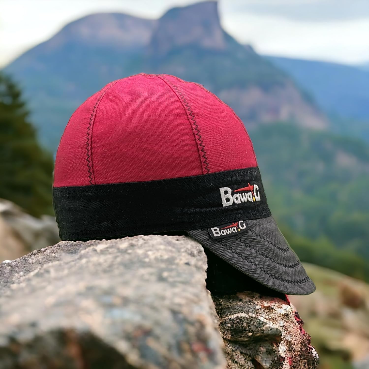 Premium Bawa.G Welding Cap Rests on a Rocky Outcrop