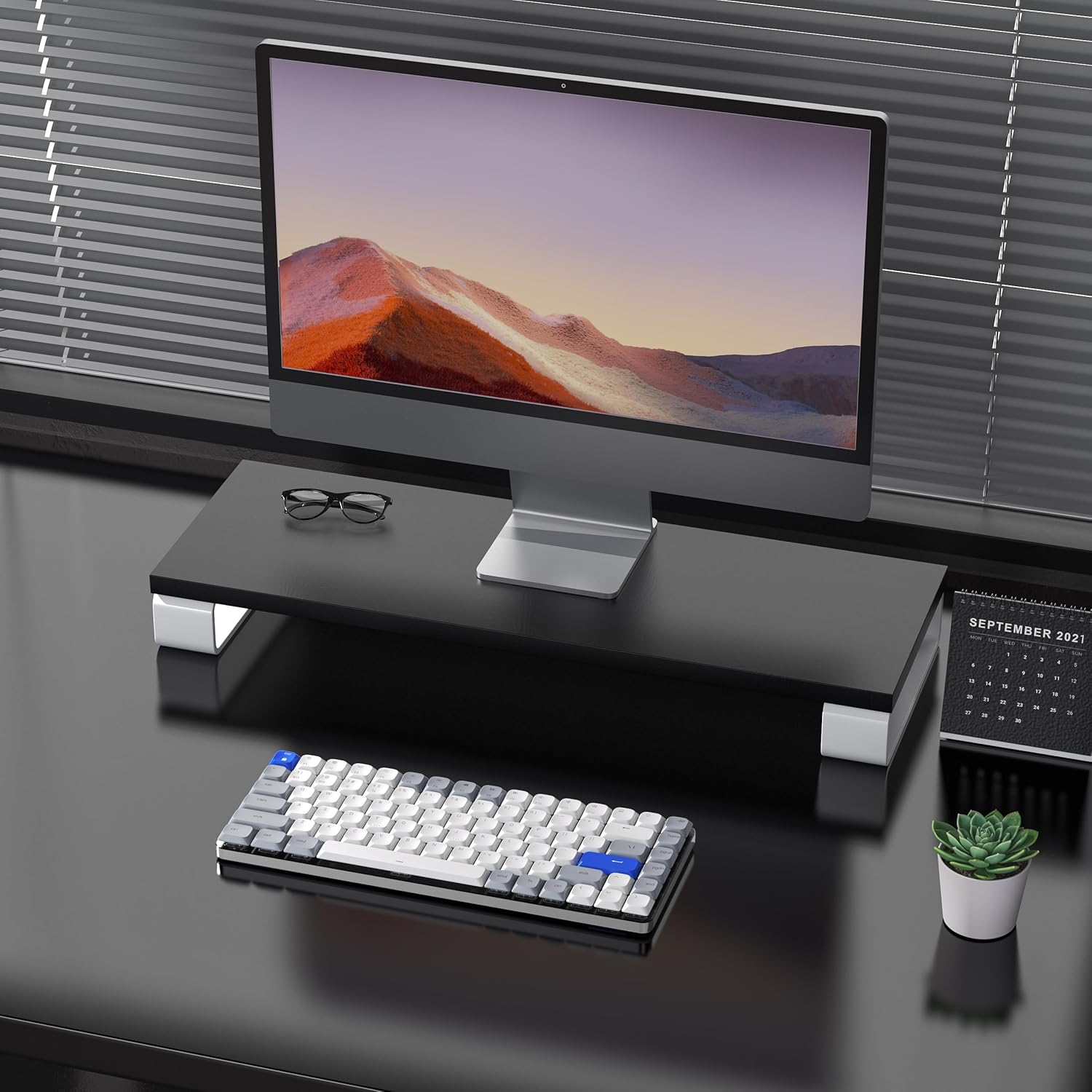 AUSDOM Airkey84 keyboard on a desk setup with a monitor and laptop, showing compatibility with Mac and Windows.