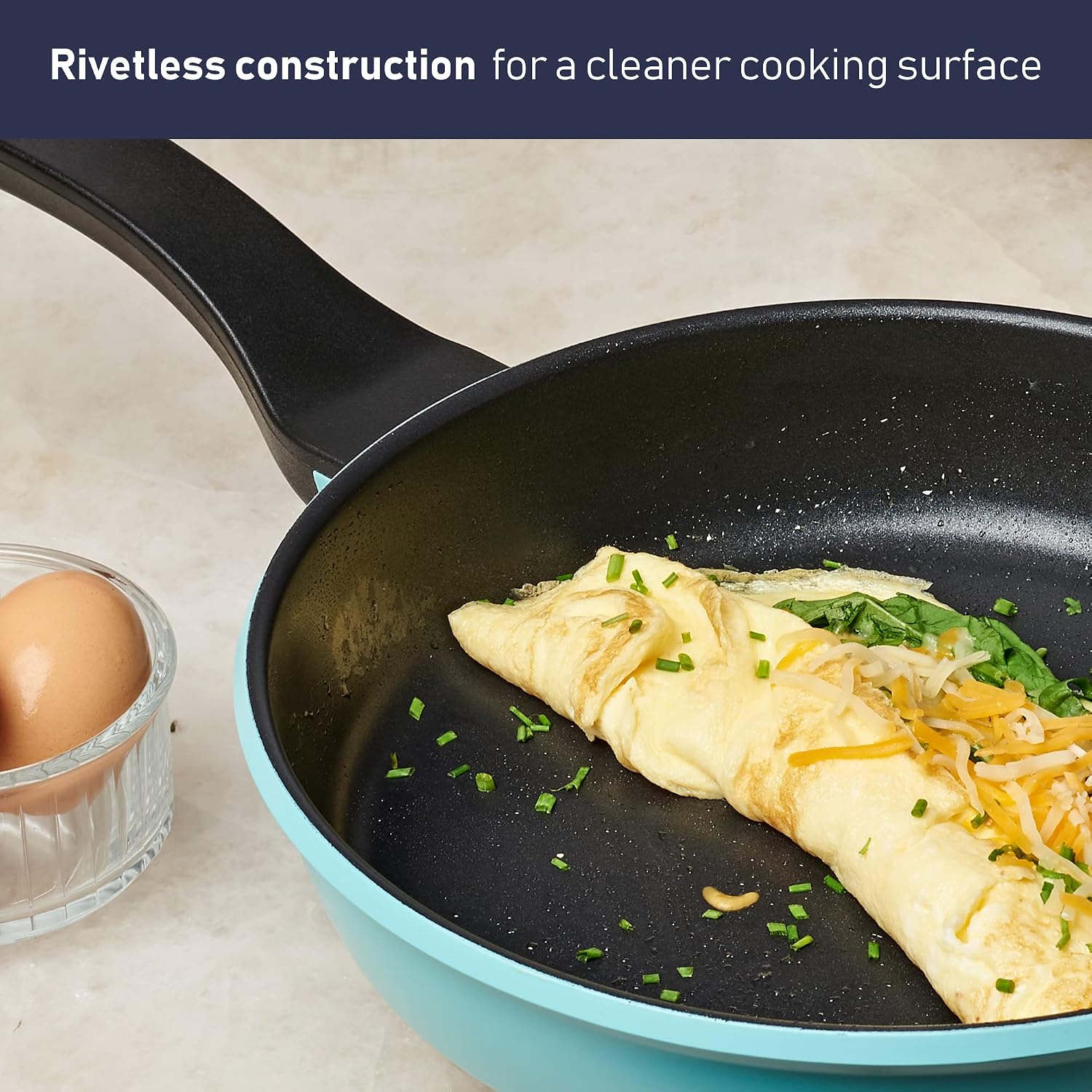 Close-up of a Bergner Retro fry pan showing rivetless construction and an omelet.