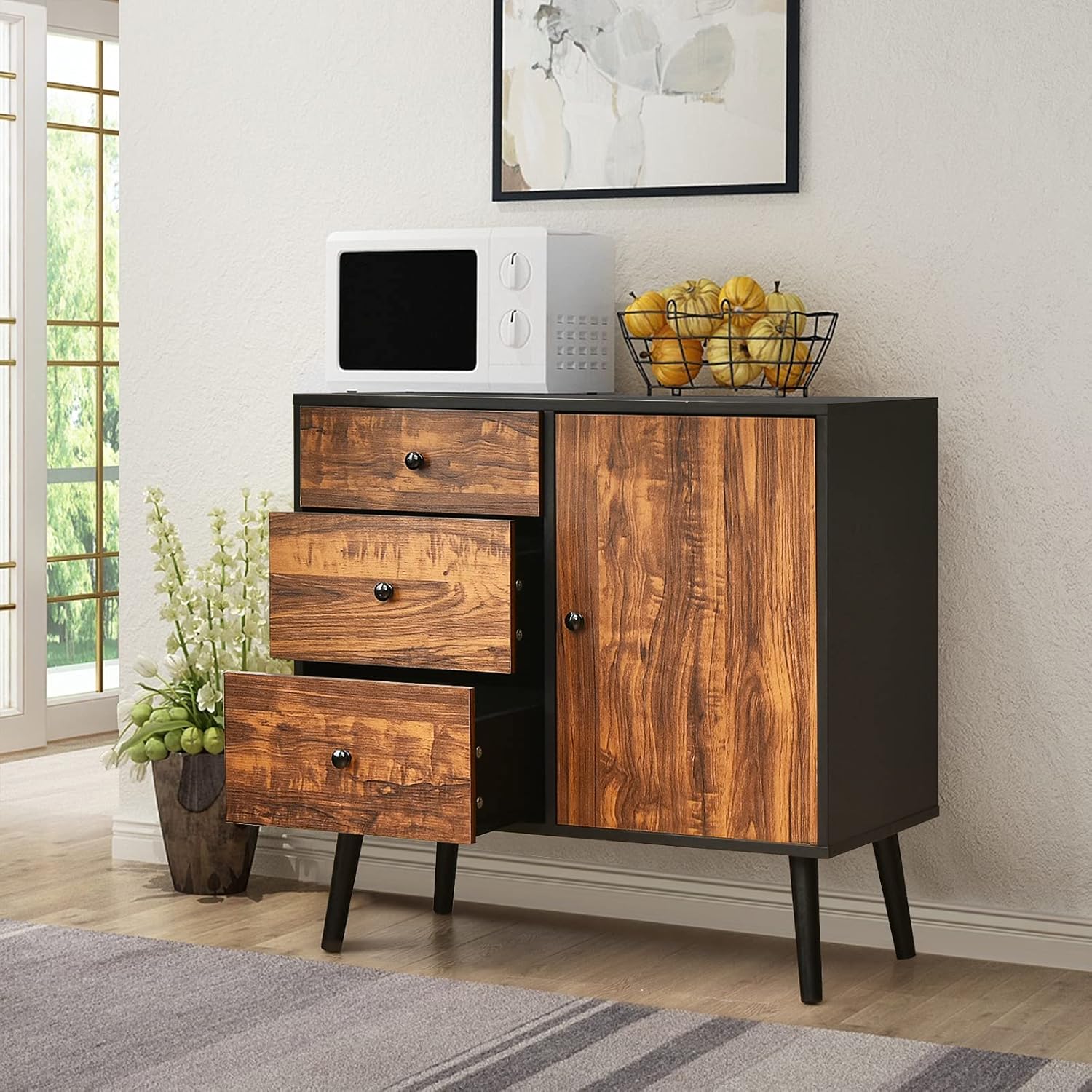 Giantex Storage Cabinet with a microwave and fruit bowl on top, demonstrating its use as a microwave stand.