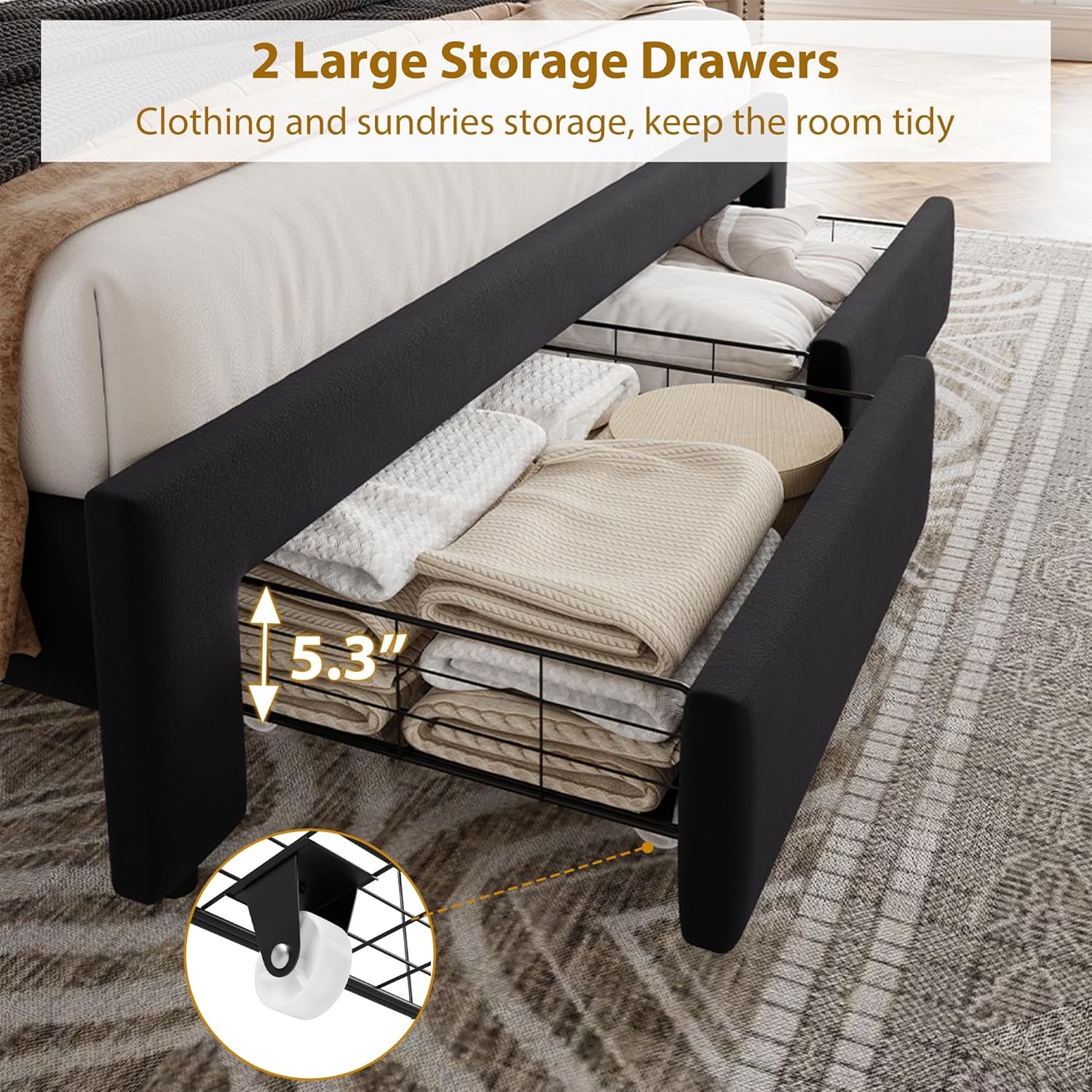 Two large storage drawers pulled out from under the bed frame, filled with folded clothes and pillows.