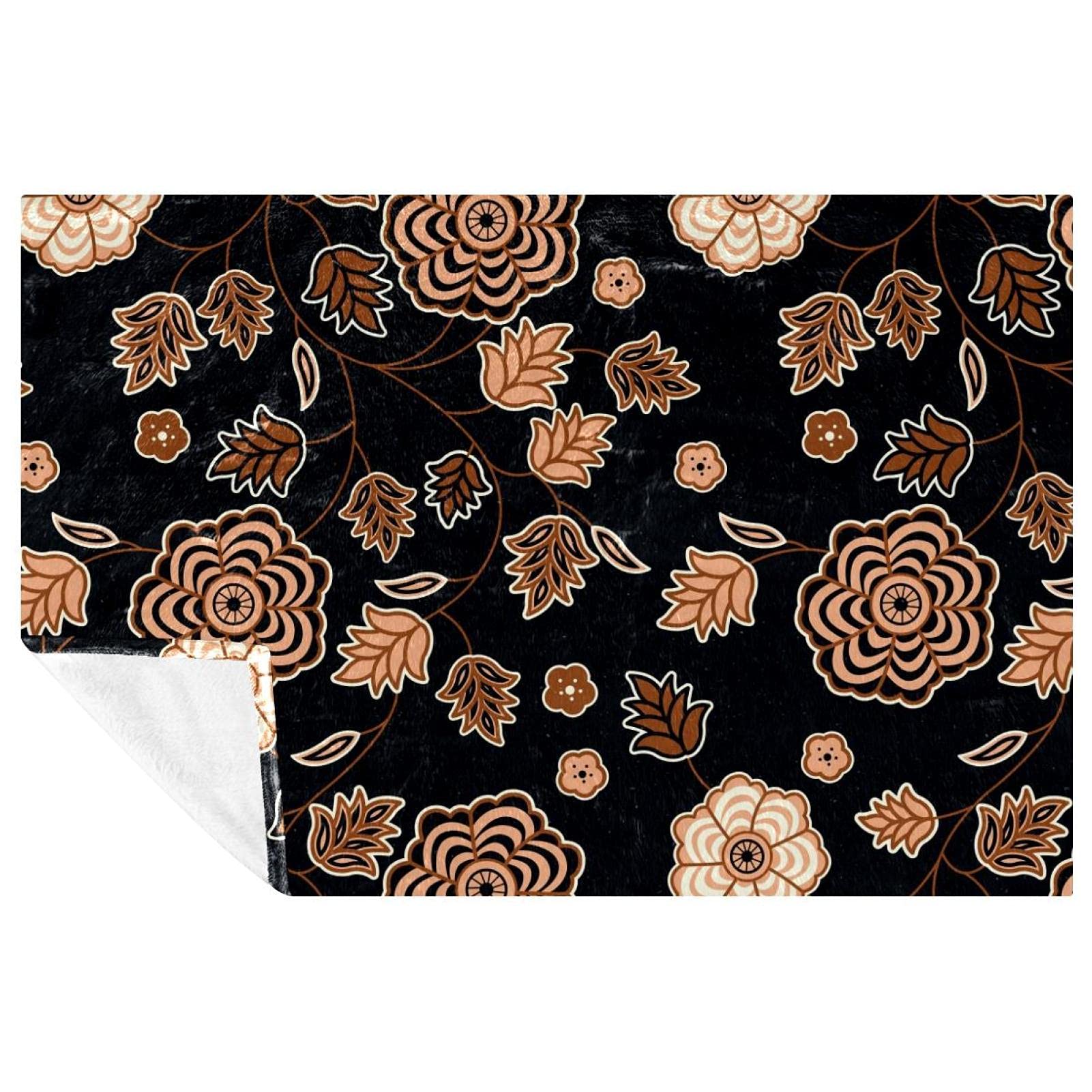 Couverture vintage florale noire, le plaid doux et chaud pour des soirées réconfortantes