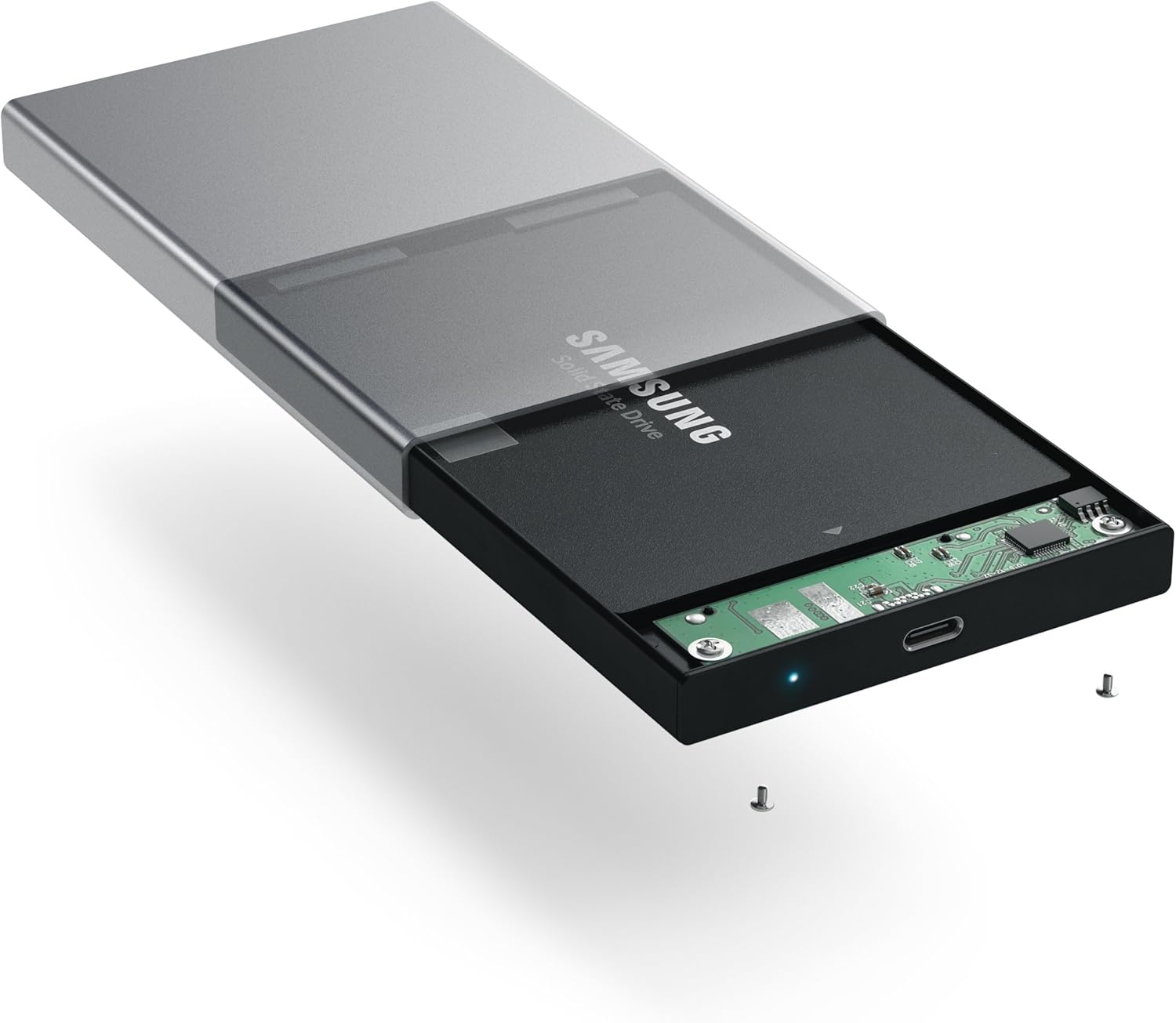 A 2.5-inch SSD being inserted into the internal tray of the Satechi enclosure.