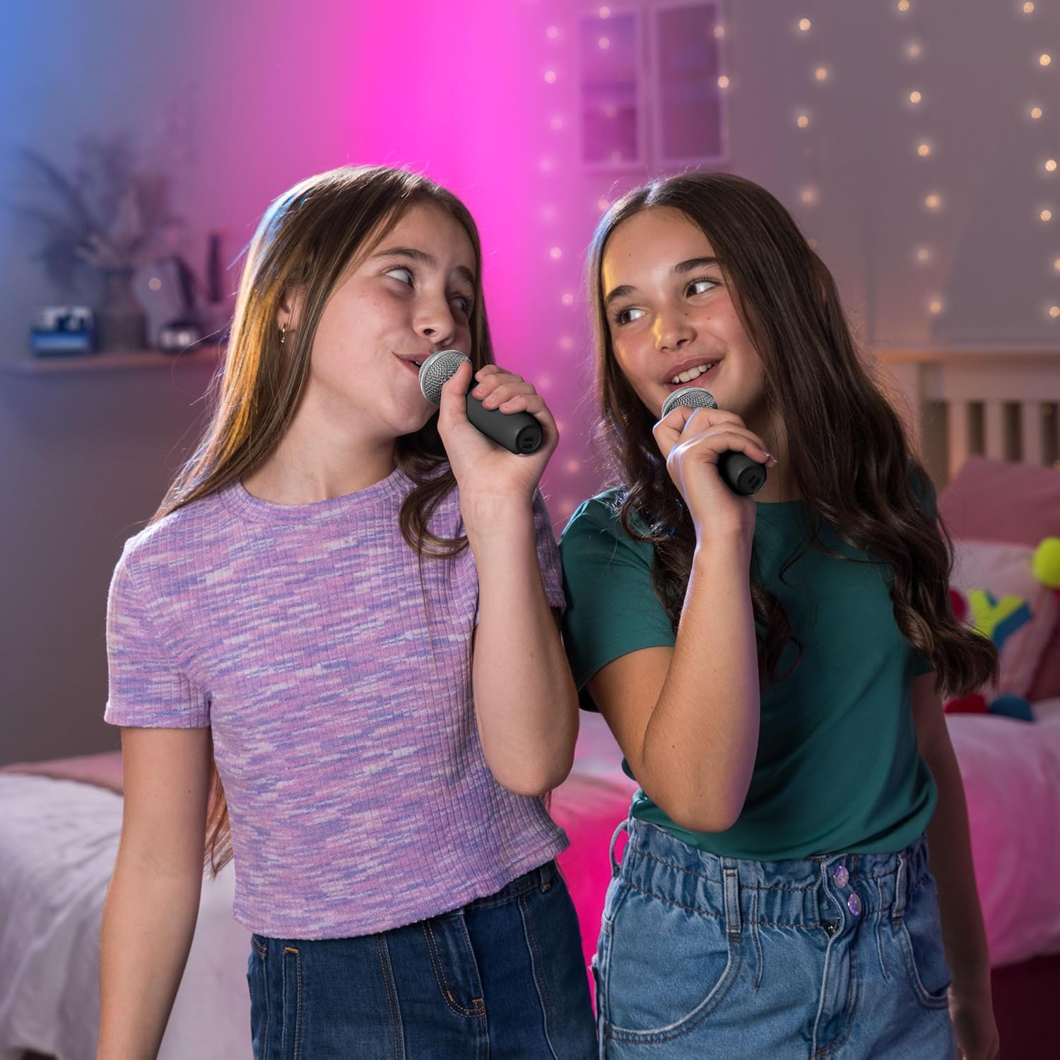 Two children singing into the Mi-Mic wireless microphones