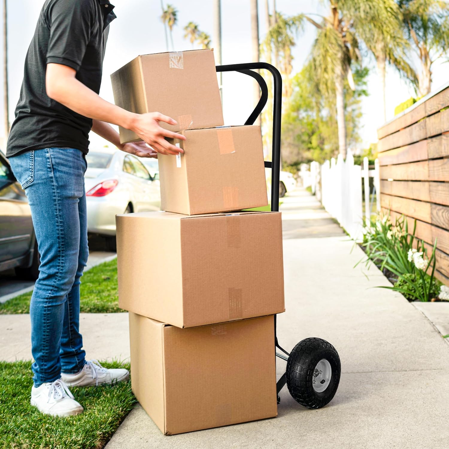 Person loading boxes onto Olympia Tools hand truck