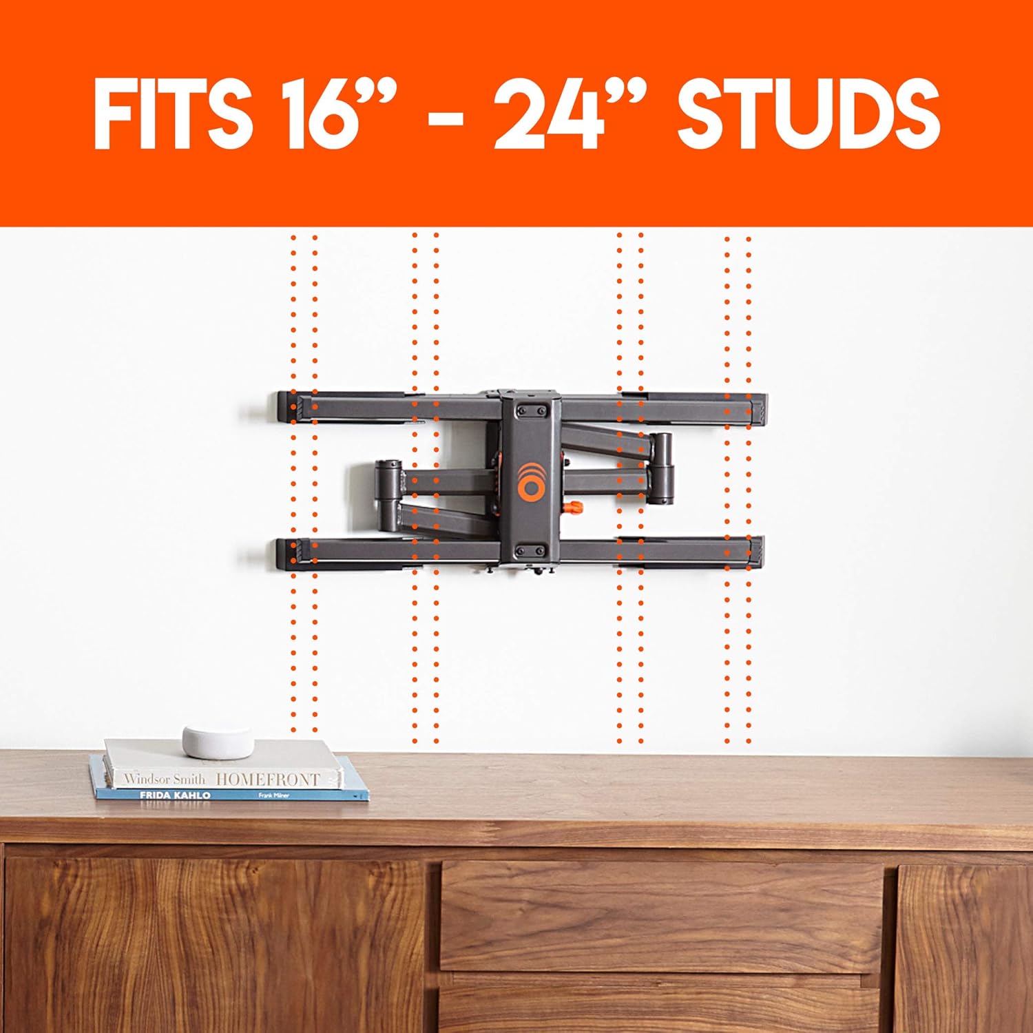 TV mount installed on a wall, illustrating compatibility with 16-inch and 24-inch stud spacing.