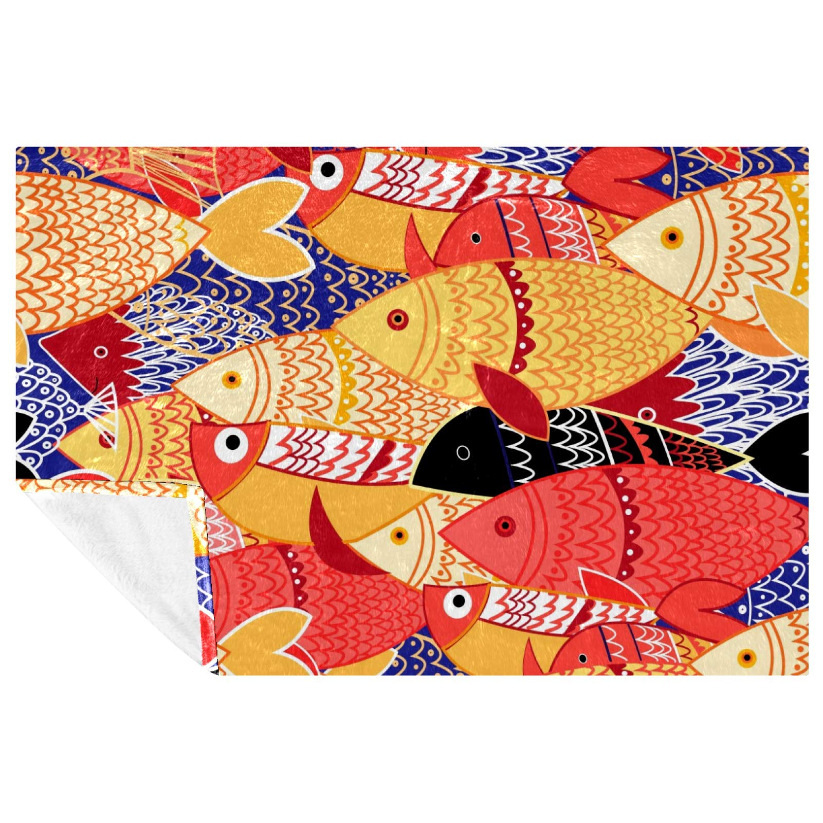 Couverture douce aux motifs poissons colorés idéale pour vos pique-niques et sorties plage
