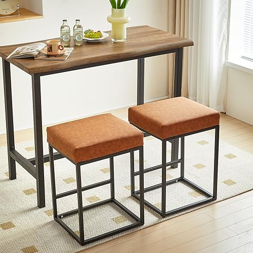 Juego de 2 taburetes de bar de 24 pulgadas de altura de mostrador, modernos taburetes de bar tapizados de piel sintética con patas de metal negro
