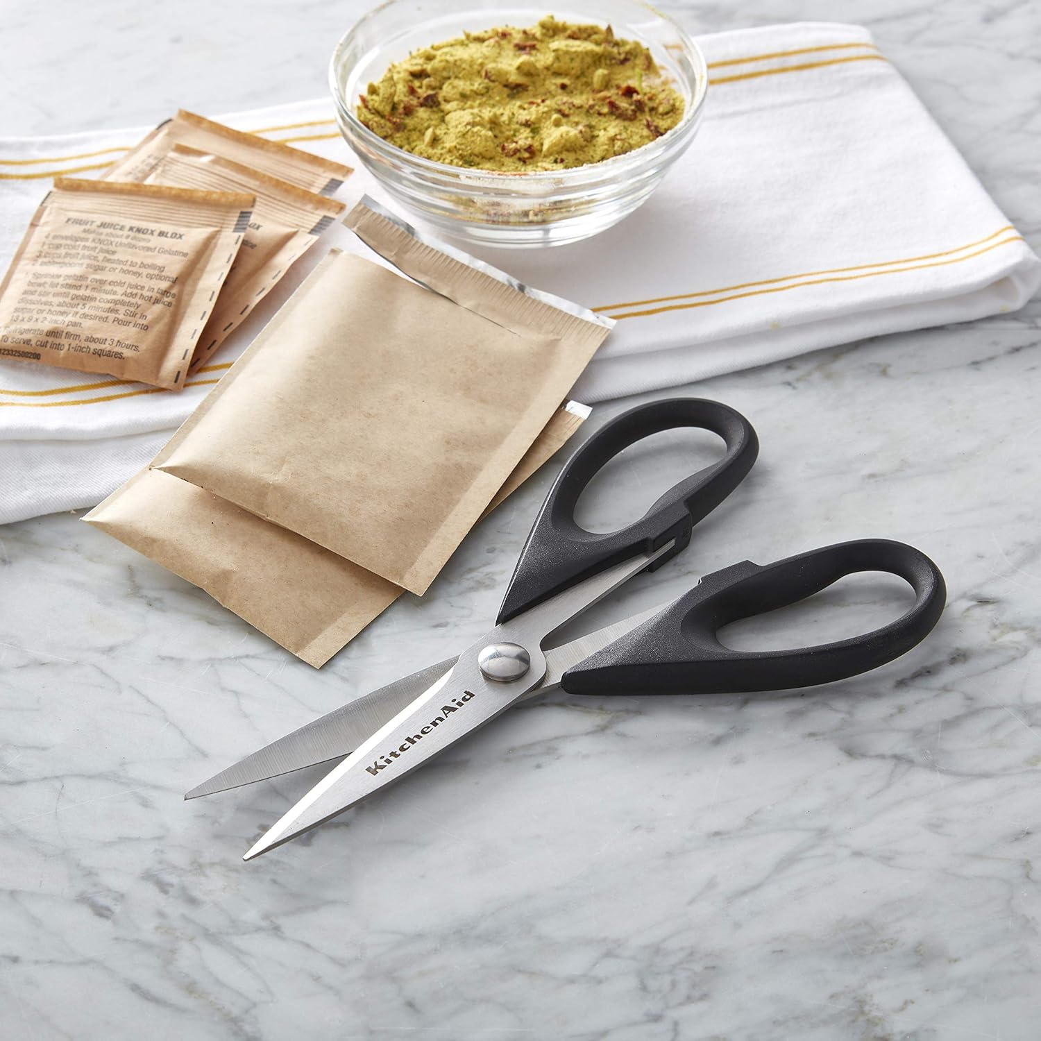 KitchenAid All-Purpose Shears cutting open a food package