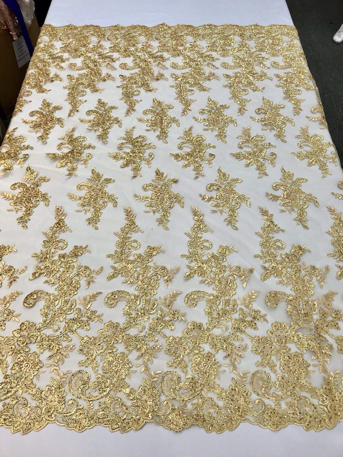 METALLIC GOLD FLORAL DESIGN EMBROIDER WITH SEQUINS-CORDED LACE-SOLD BY THE YARD.