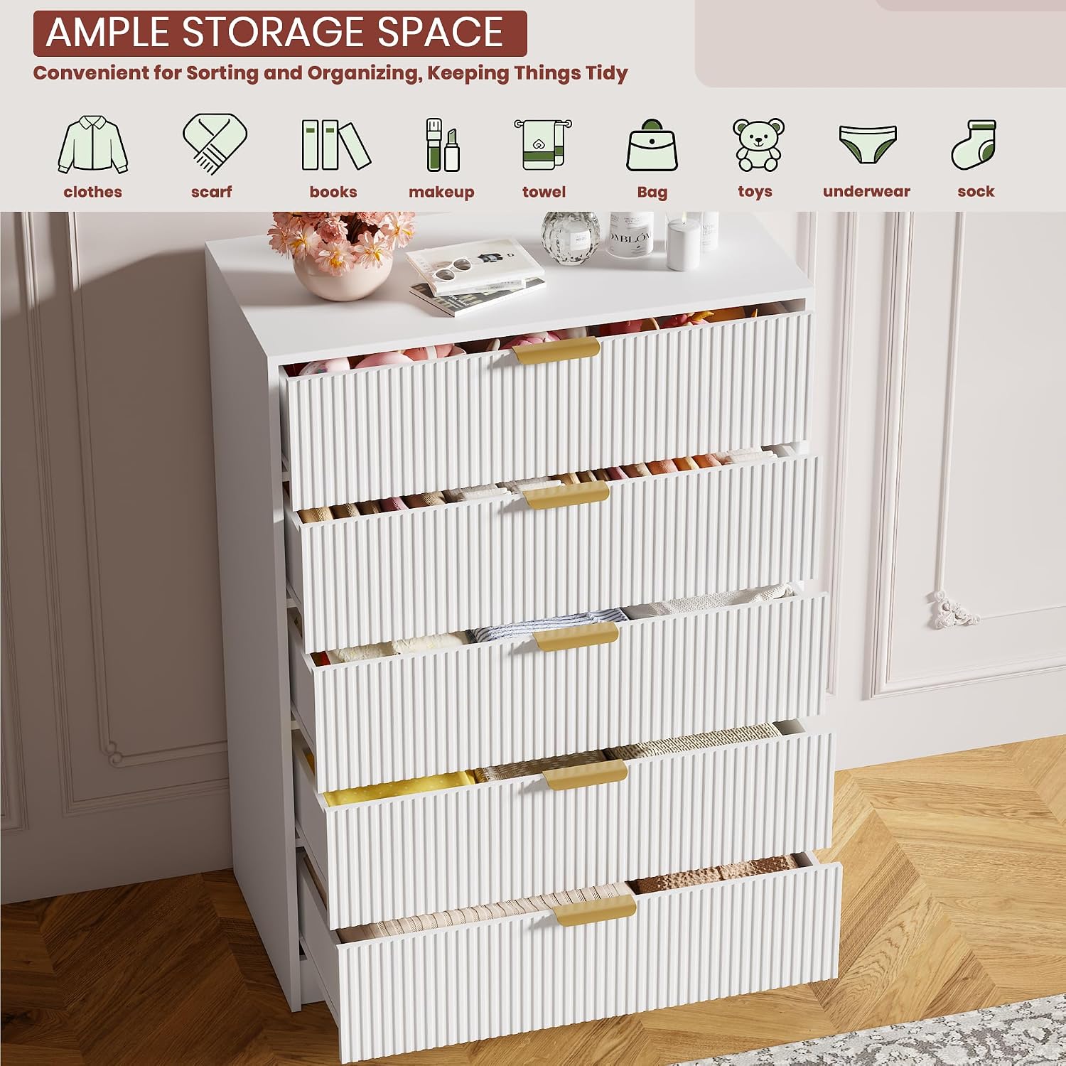 A white 5-drawer dresser with all drawers partially open, revealing various organized items like clothes, books, and accessories, demonstrating its ample ຄວາມອາດສາມາດເກັບຮັກສາ.