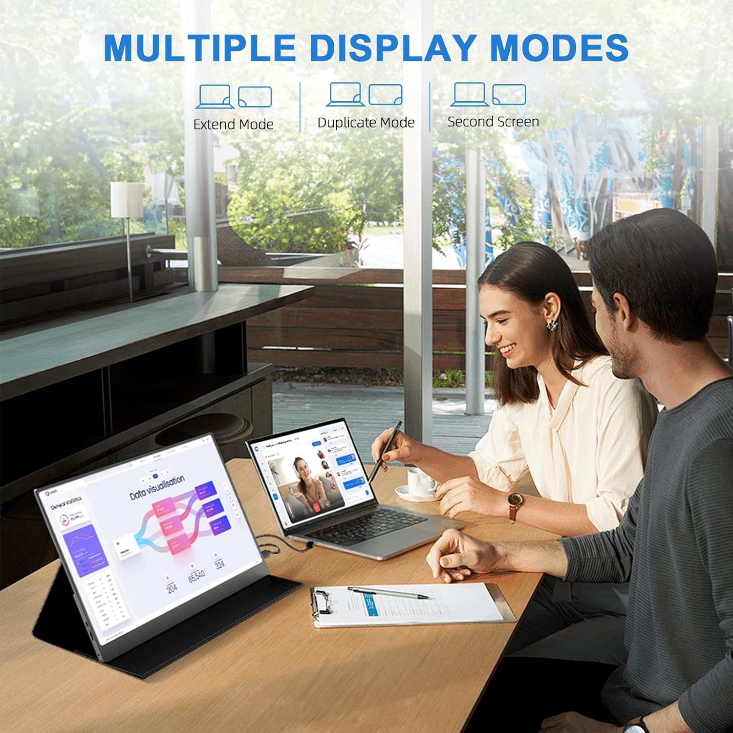 Portable monitor mounted vertically on a VESA stand next to a desktop monitor