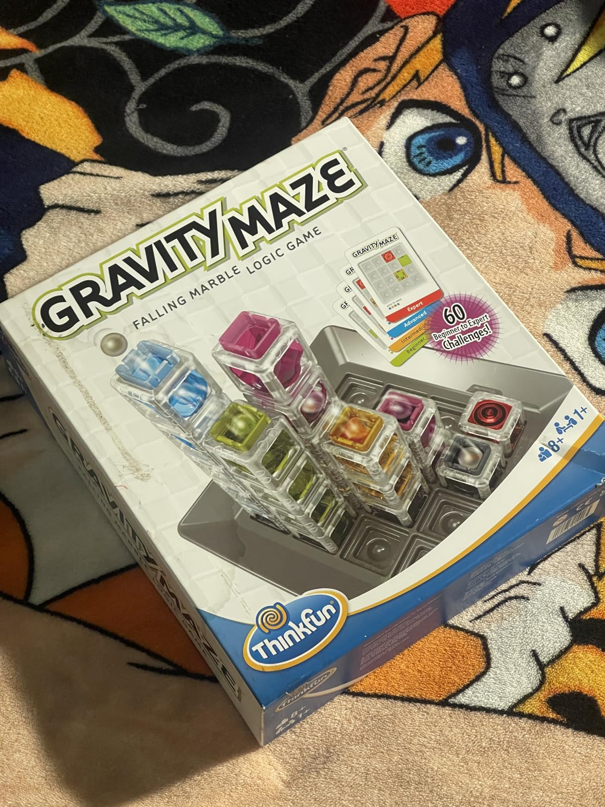 ThinkFun Gravity Maze showing the tower pieces arranged on the game grid with a marble ready to run through the course