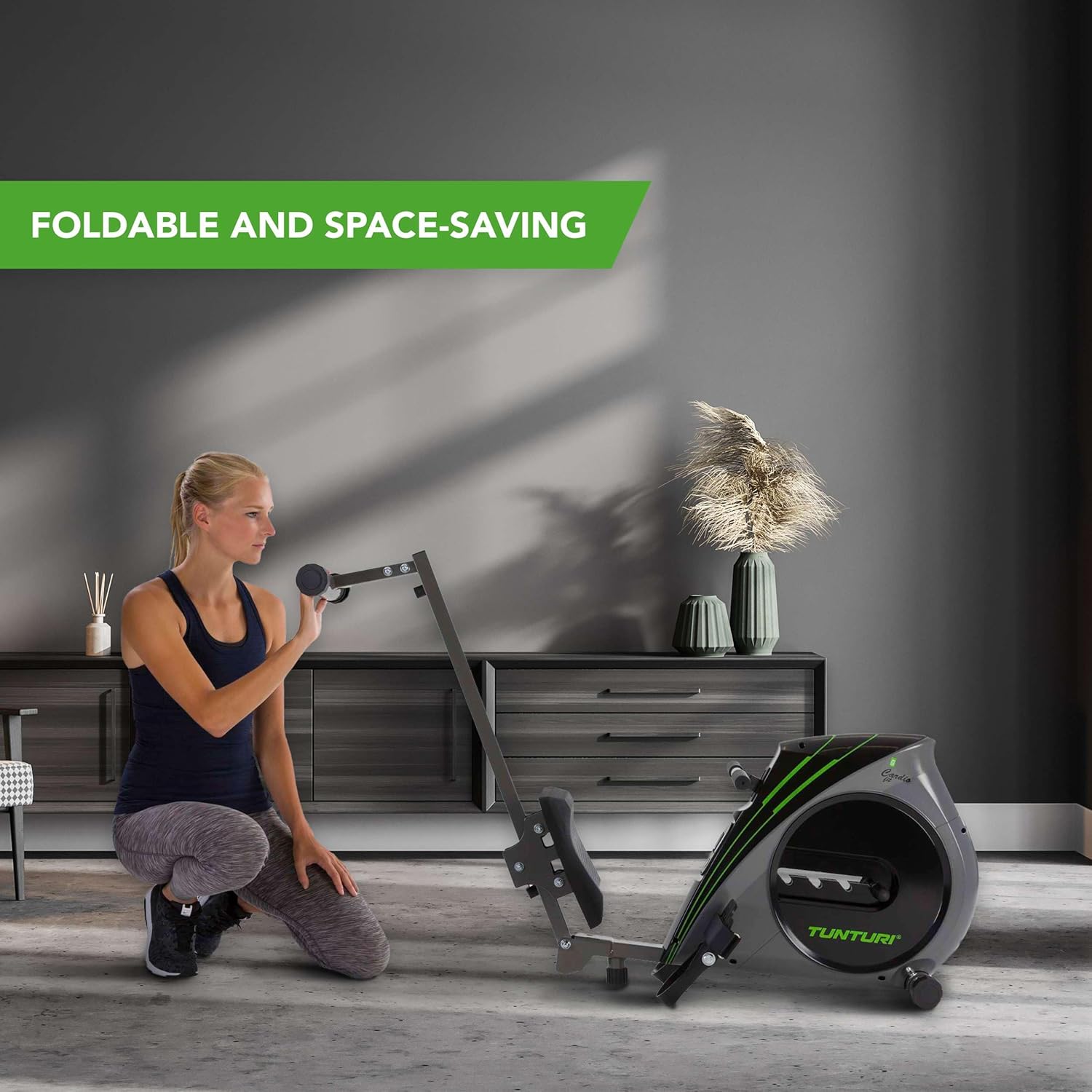 Woman folding Tunturi Cardio Fit R20 Rower