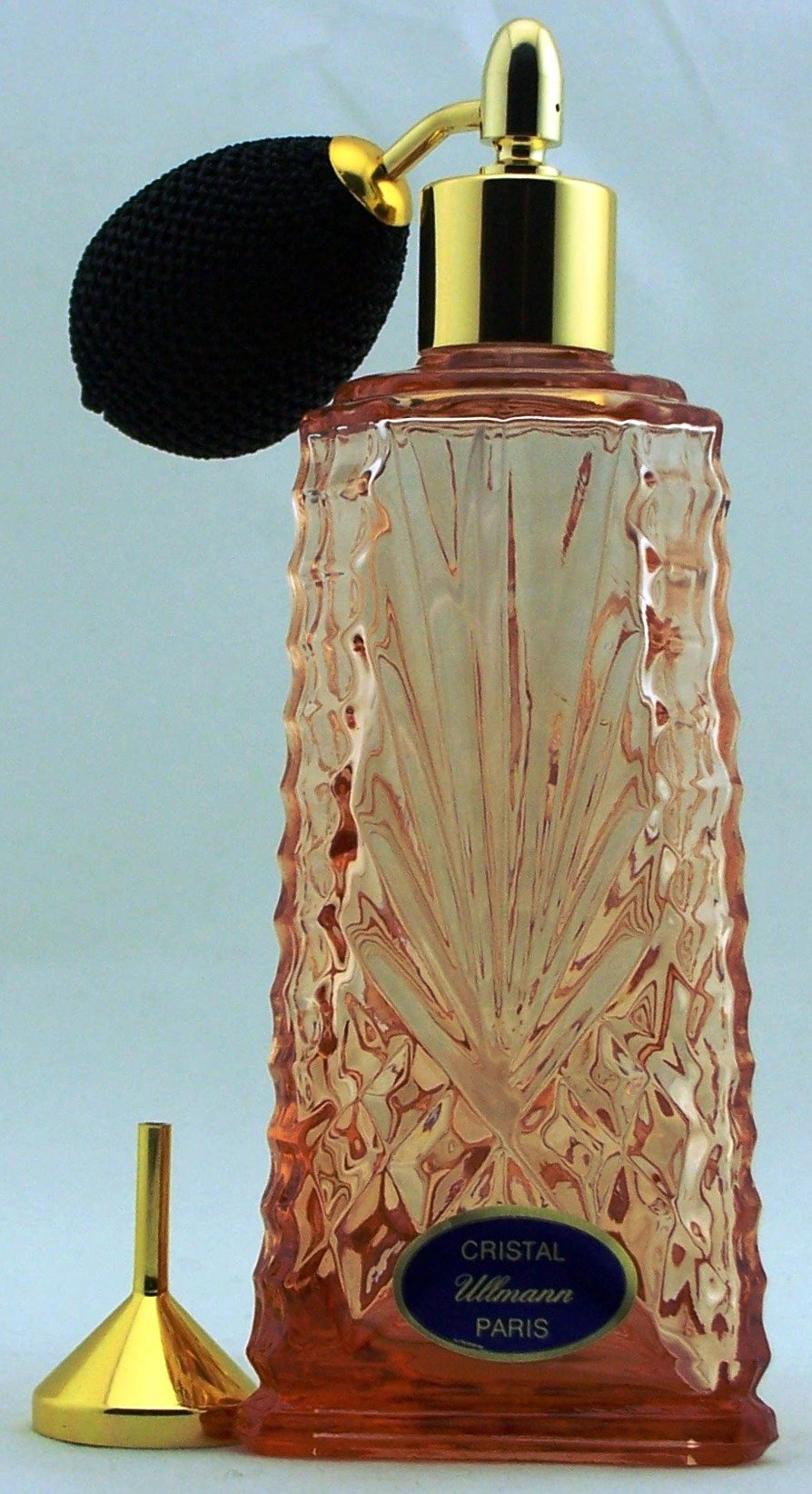 Vaporisateur cristal rose et pompon noir en coffret cadeau bleu pour un présent d'exception