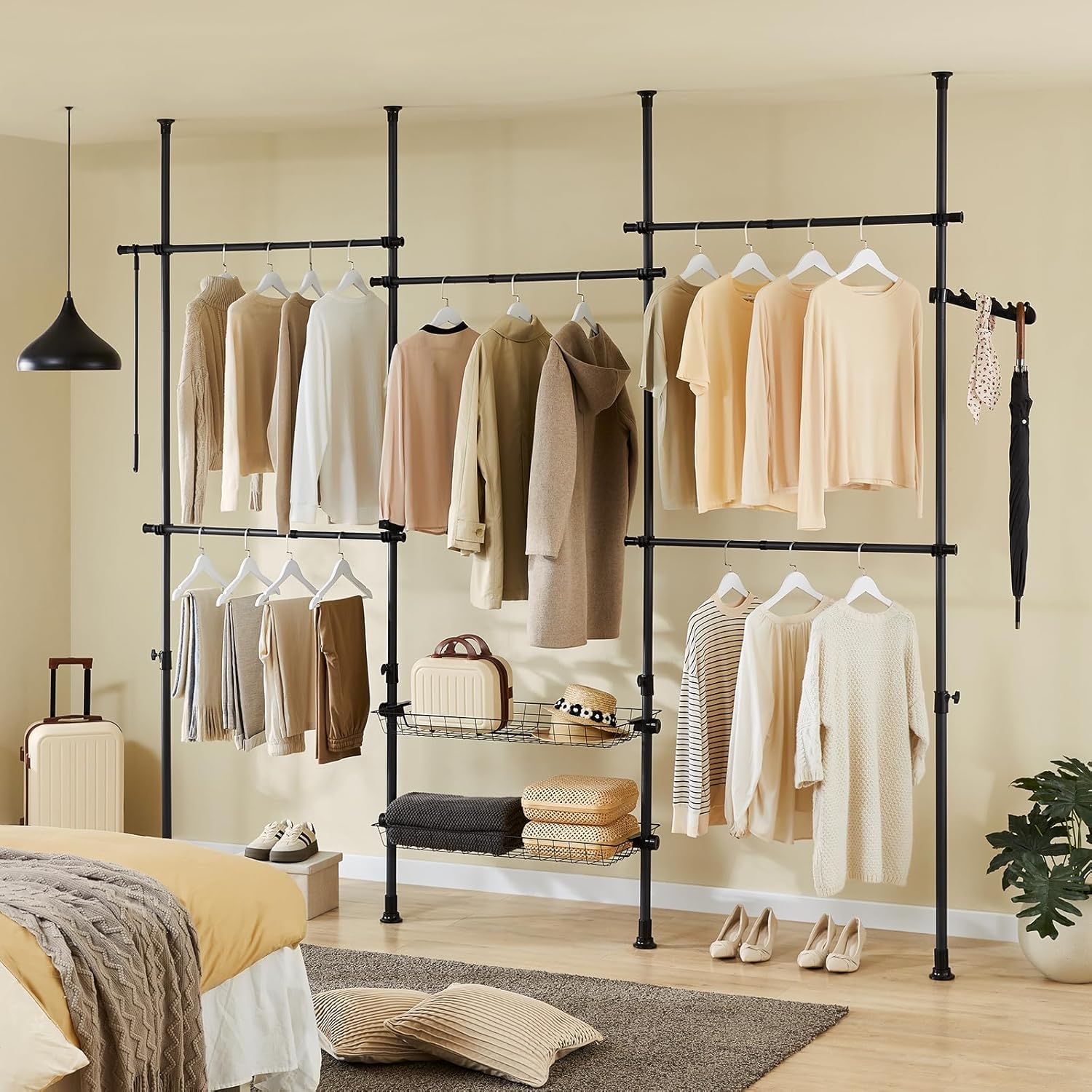 Assembled SoBuy KLS04-SCH telescopic clothes rack in a room, showcasing its adjustable configuration.