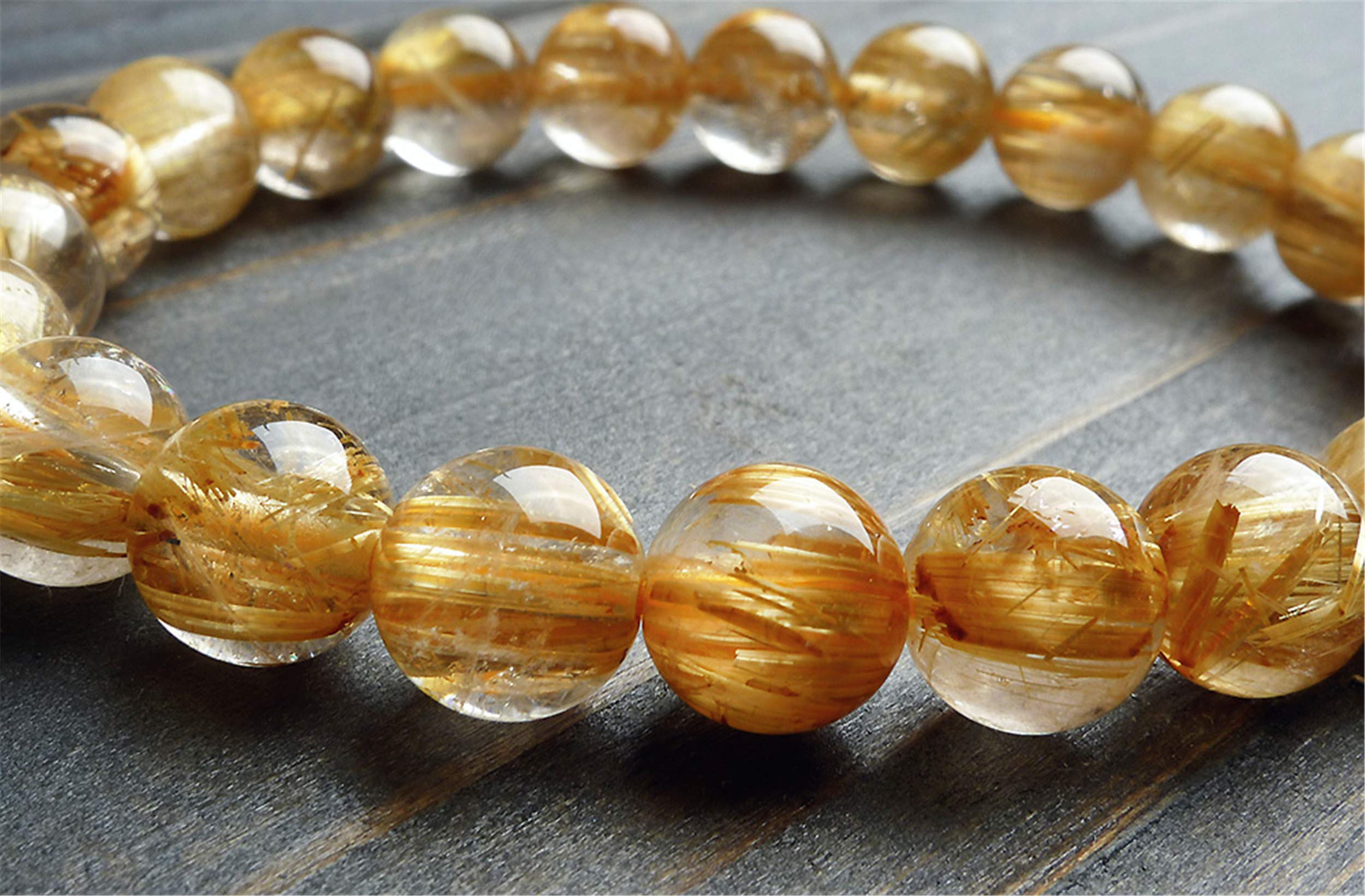 Bracciale elasticizzato con perline rotonde di cristallo di quarzo rutilato giallo naturale da 9 mm AAA