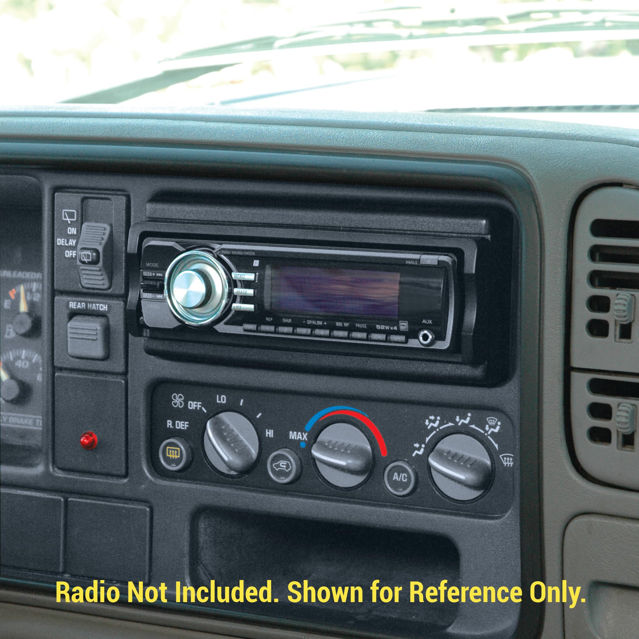 A single DIN aftermarket car stereo fully installed in a vehicle's dashboard