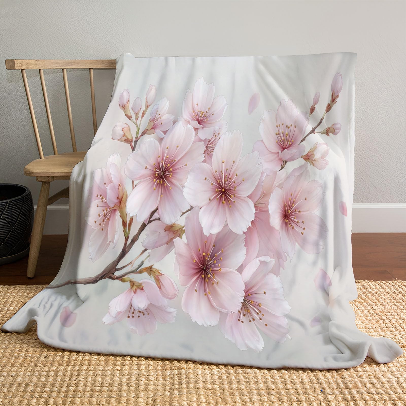 Couverture branches de cerisier rose : plaid aquarelle pour des soirées cocooning