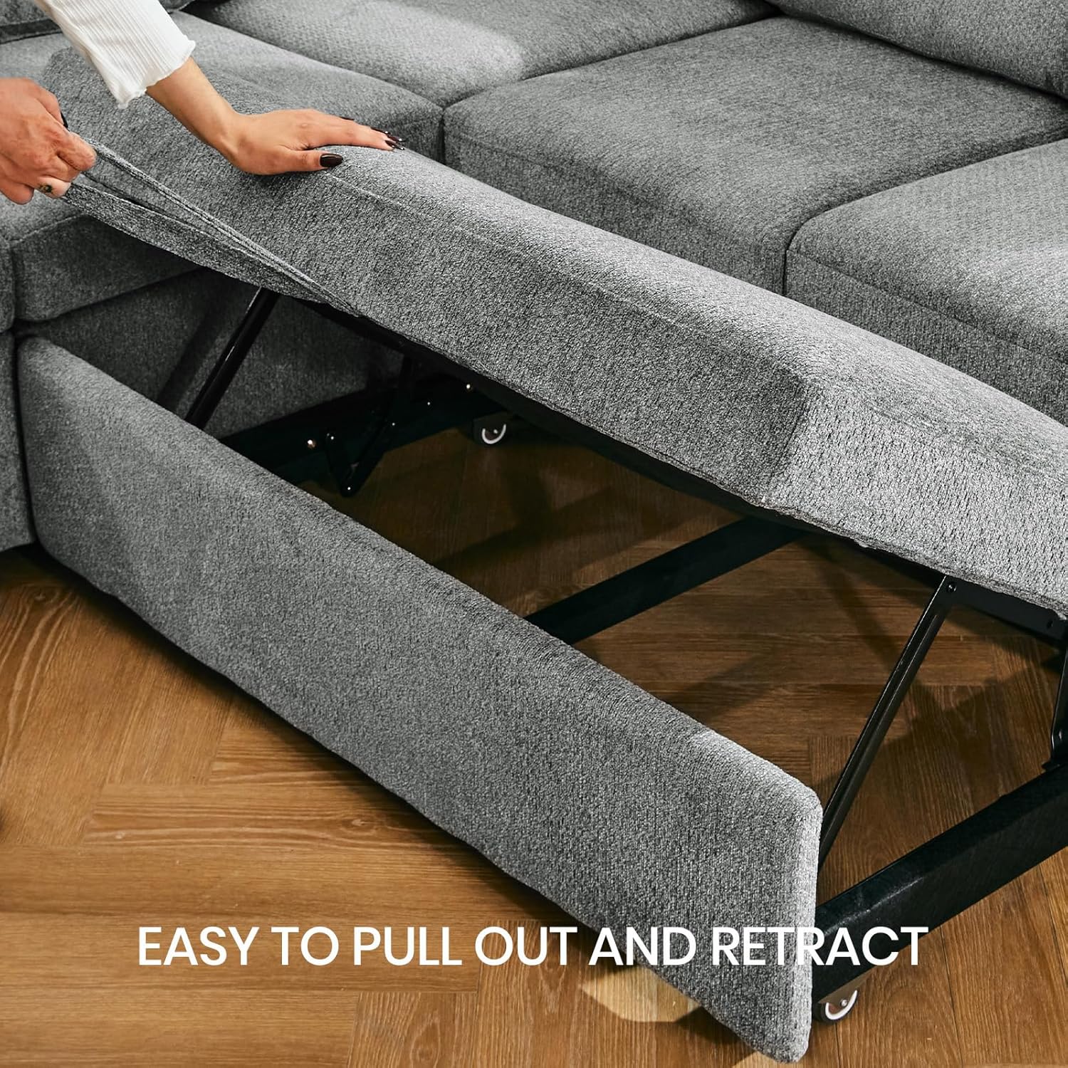 Hand pulling the fabric loop to extend the pull-out bed mechanism