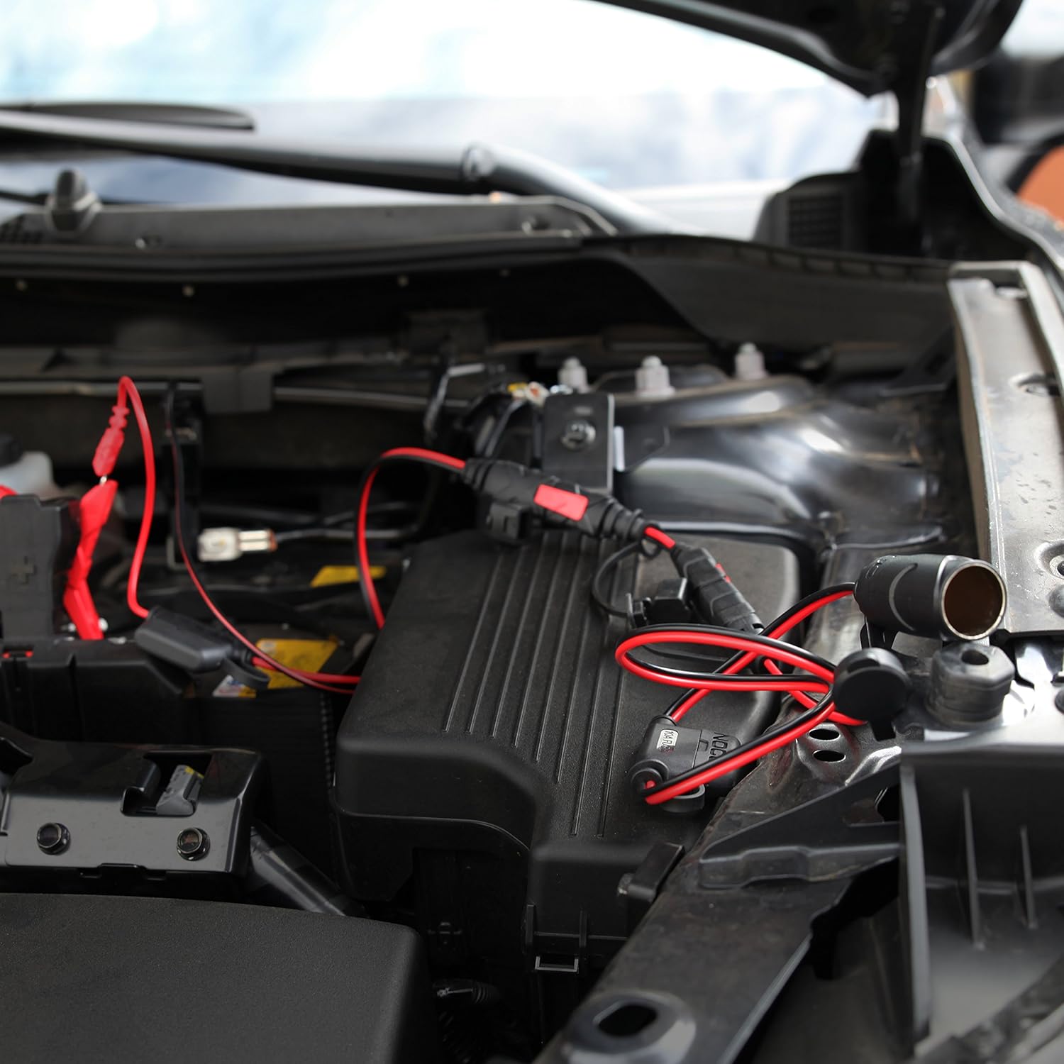 NOCO GC010 X-Connect 12V Female Plug Accessory connected to a charger and a 12V device