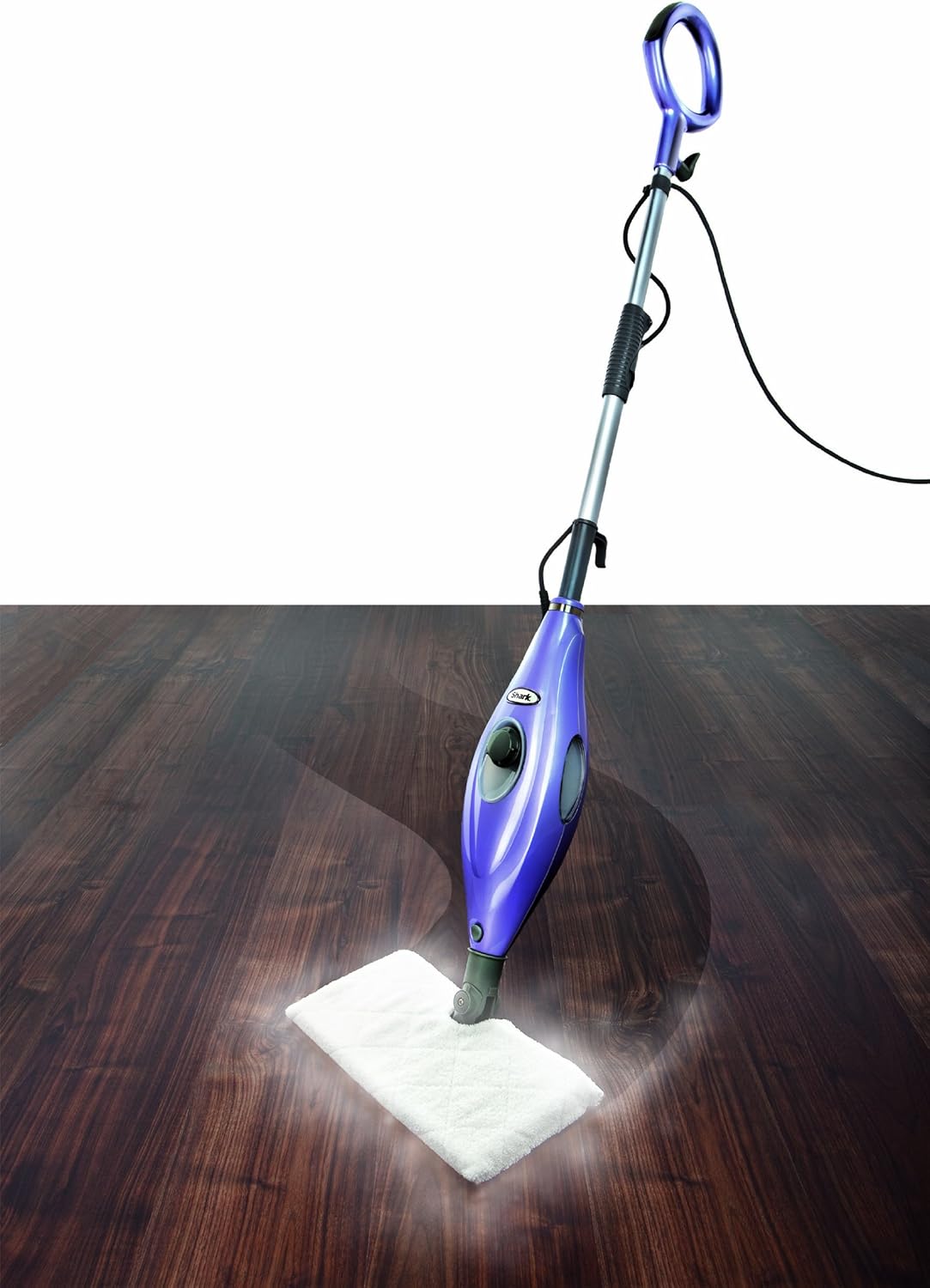 Image of the Dirt Devil M339-1 Shark Steam Mop in use on a wooden floor, emitting steam.