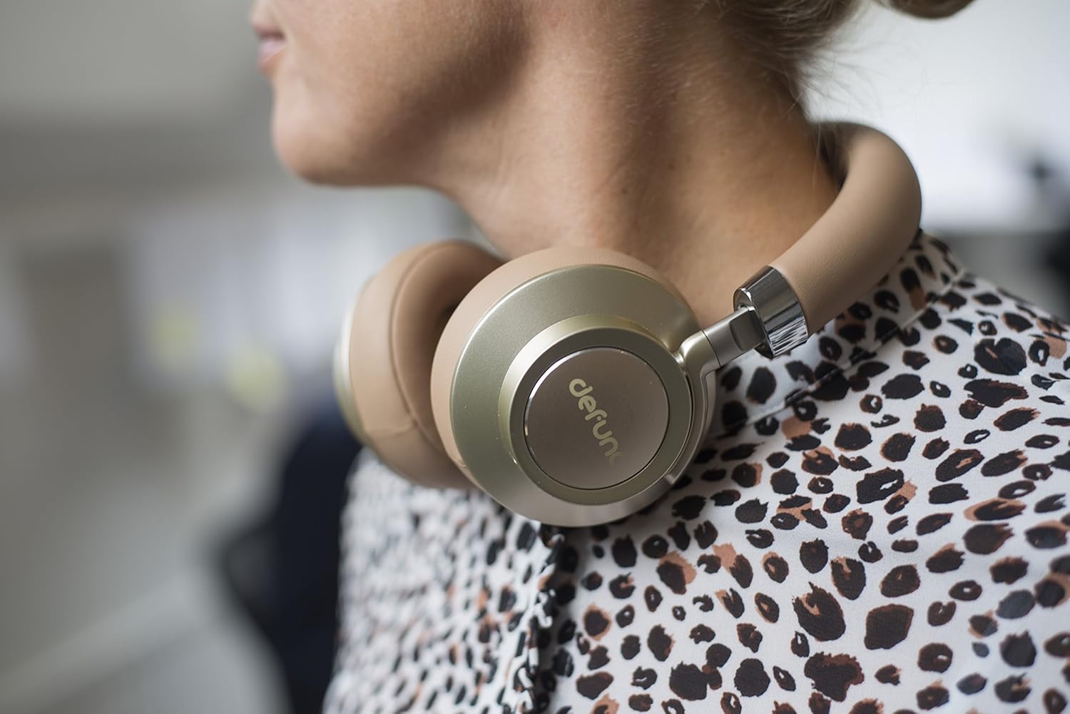 Person wearing Defunc Plus Wireless Bluetooth Headphones