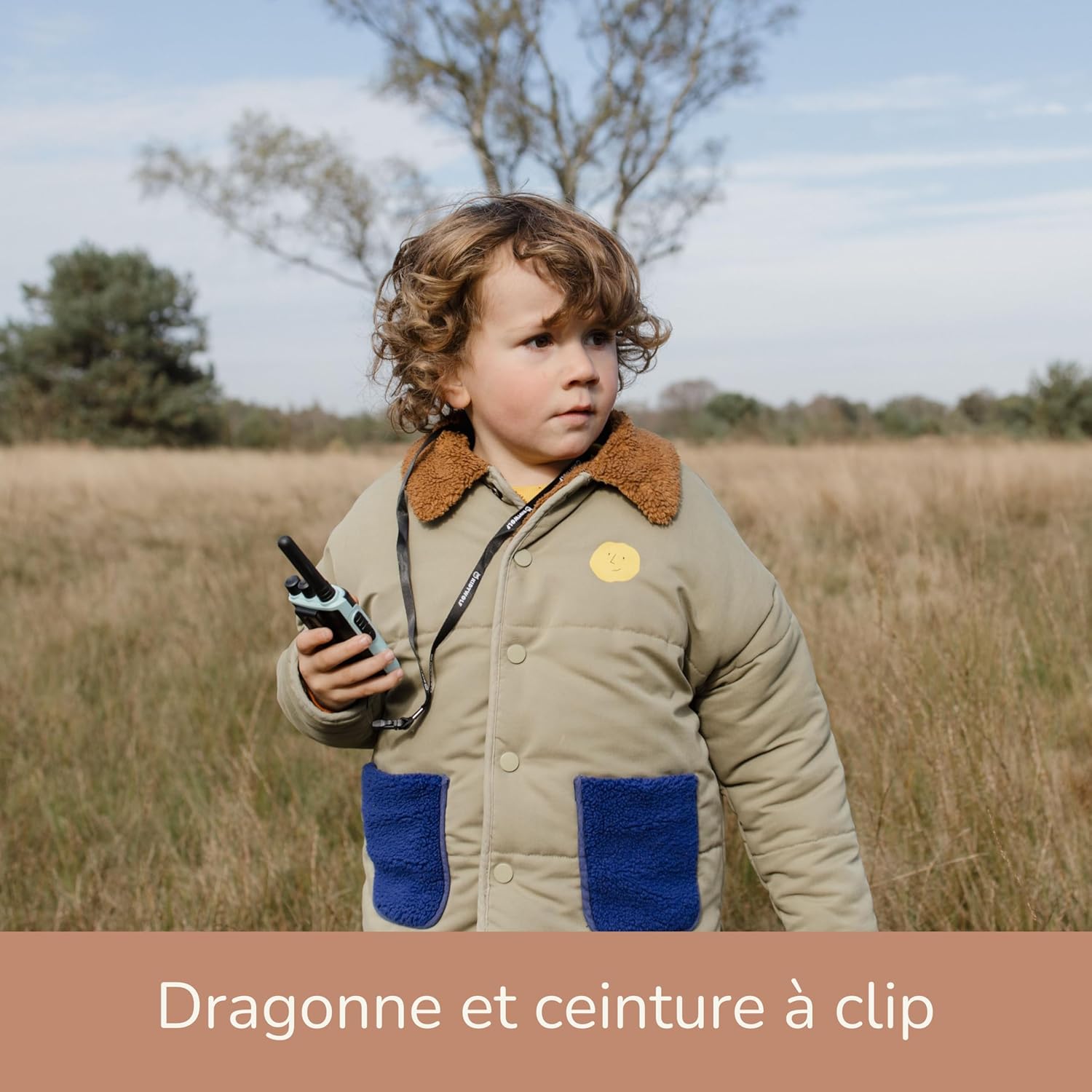 Child wearing KIDYWOLF KIDYTALK walkie-talkie with a lanyard