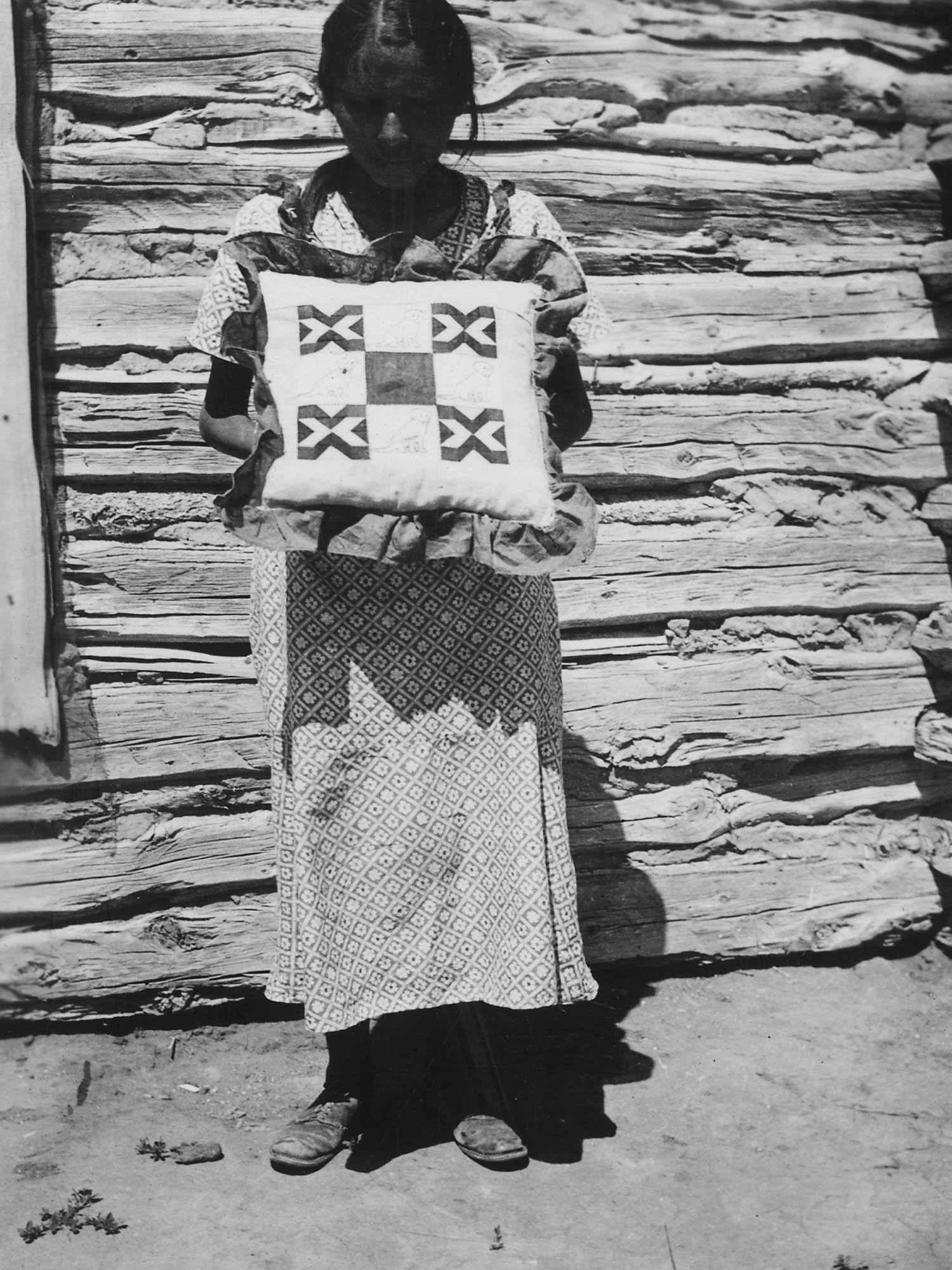 Photography Poster - Dorothy Grey Hound displays a pillow she made from muslin scraps - 8.5"x11"