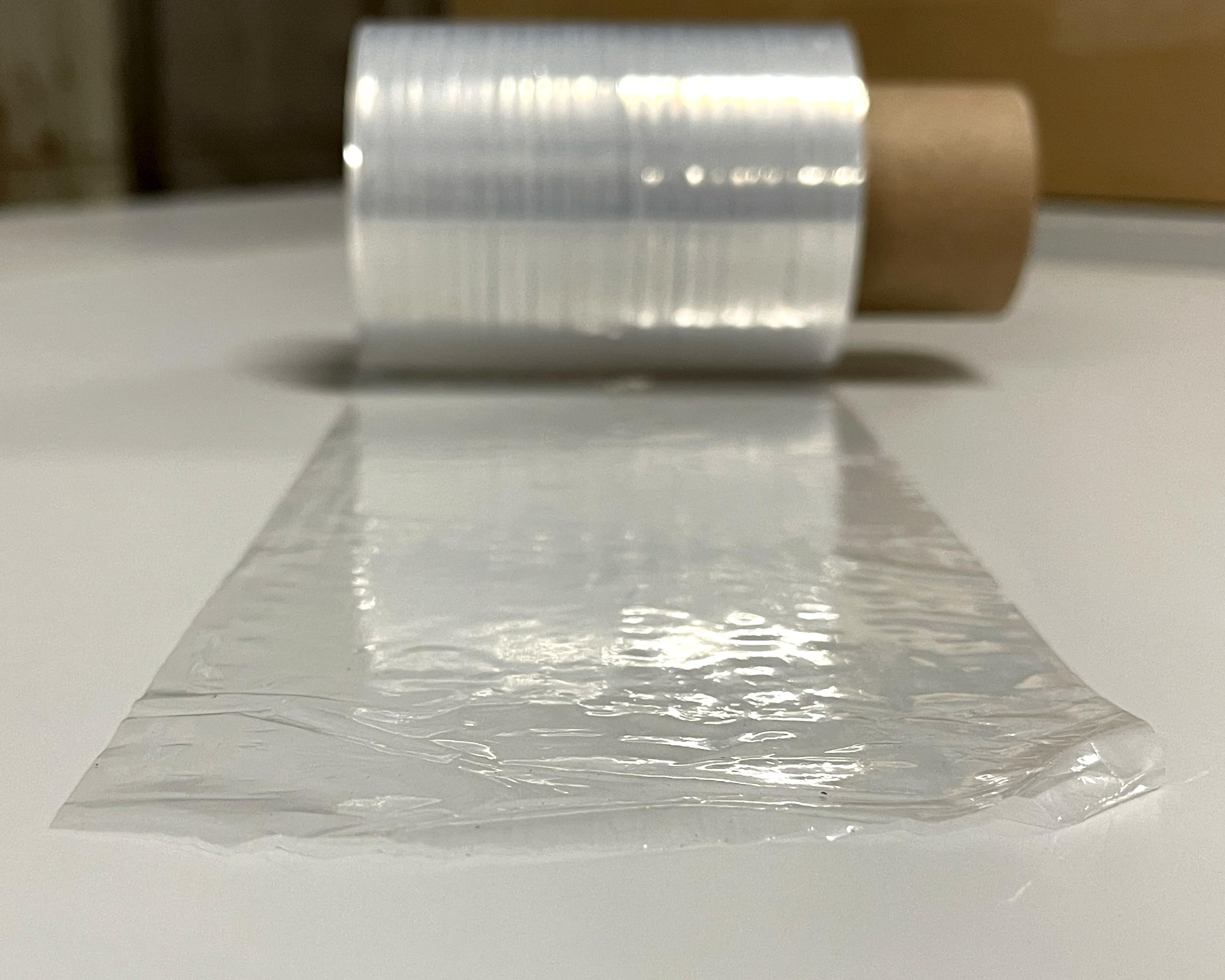 MINI FILM Manual de EMBALAR | Ancho 100mm, 125Metros de Largo, 180% ESTIRABLE | BOBINA de PLÁSTICO de POLIETILENO de 23μ Micras, 290gr | Pack: (TRANSPARENTE, 42ud)