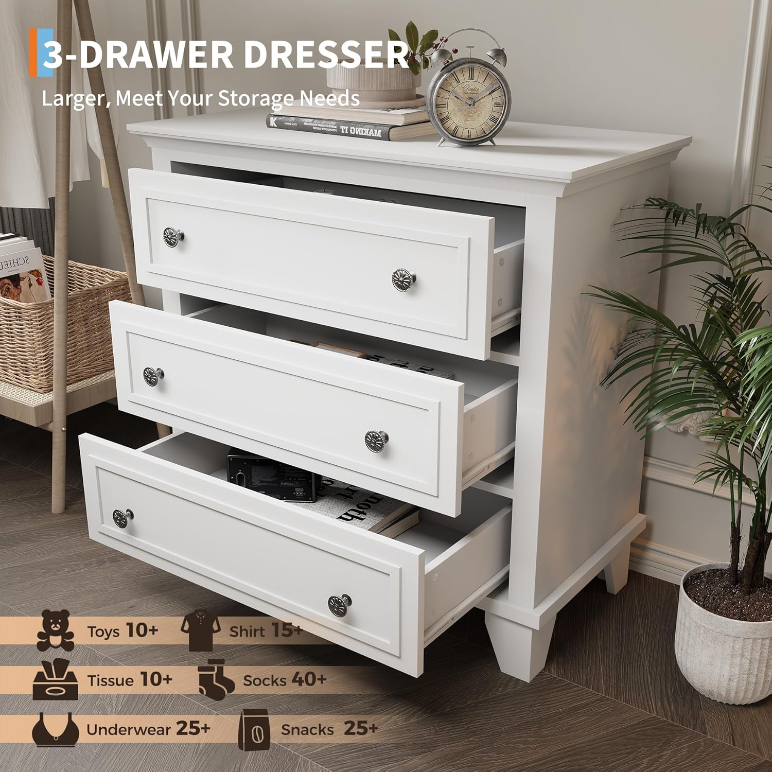 White 3-drawer dresser with all drawers partially open, showing ample storage space inside.