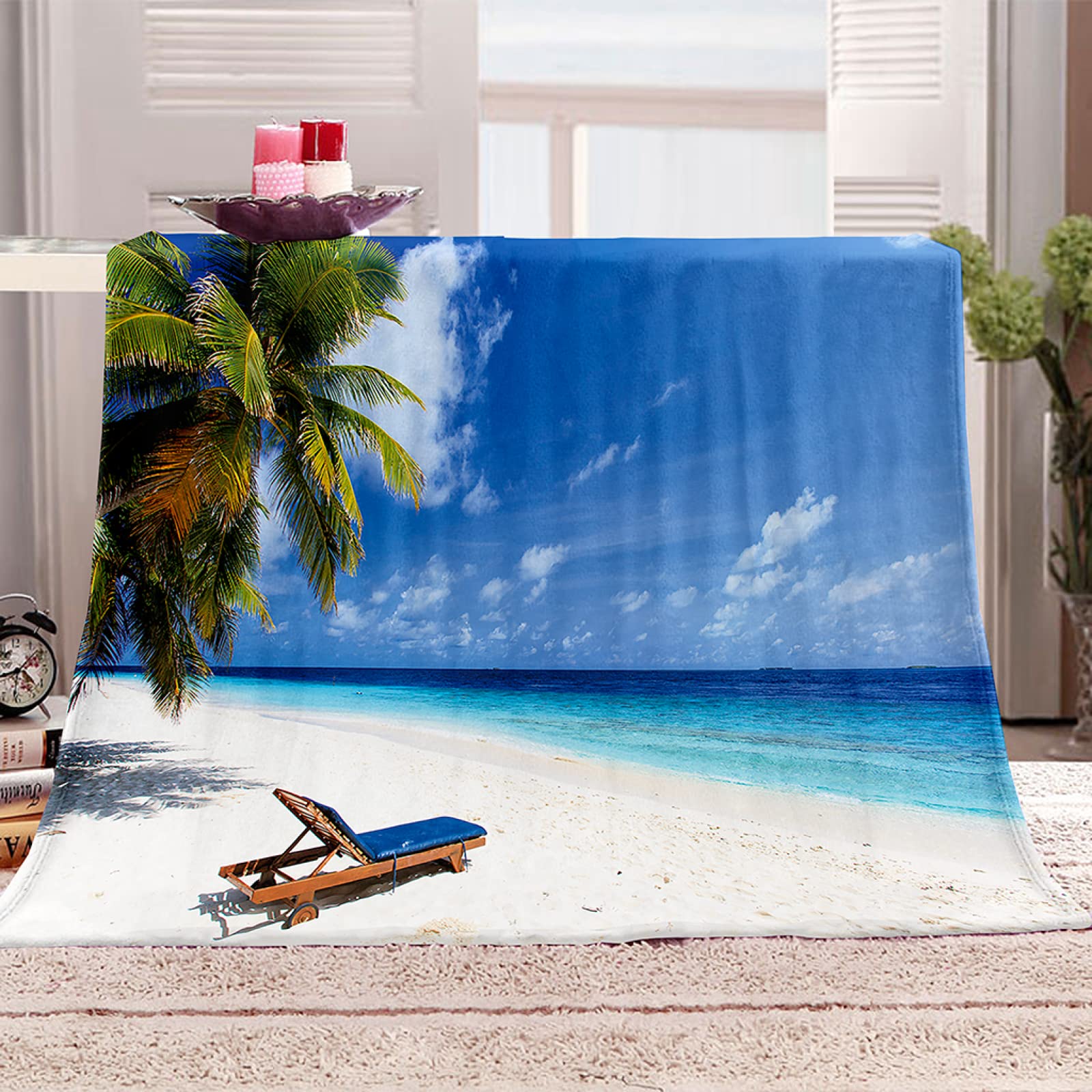 Couverture en flanelle douce pour s'évader devant la mer sur son canapé de salon