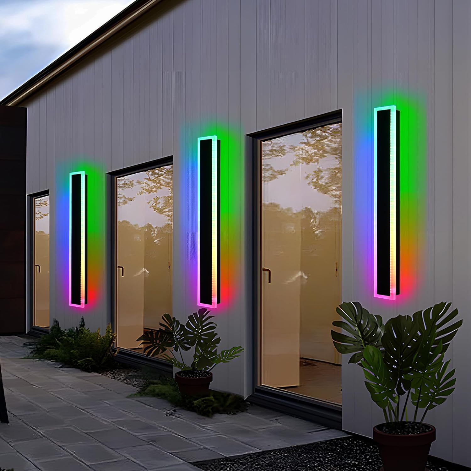 Multiple MELUCEE RGB Outdoor Wall Lights illuminating a house exterior at dusk