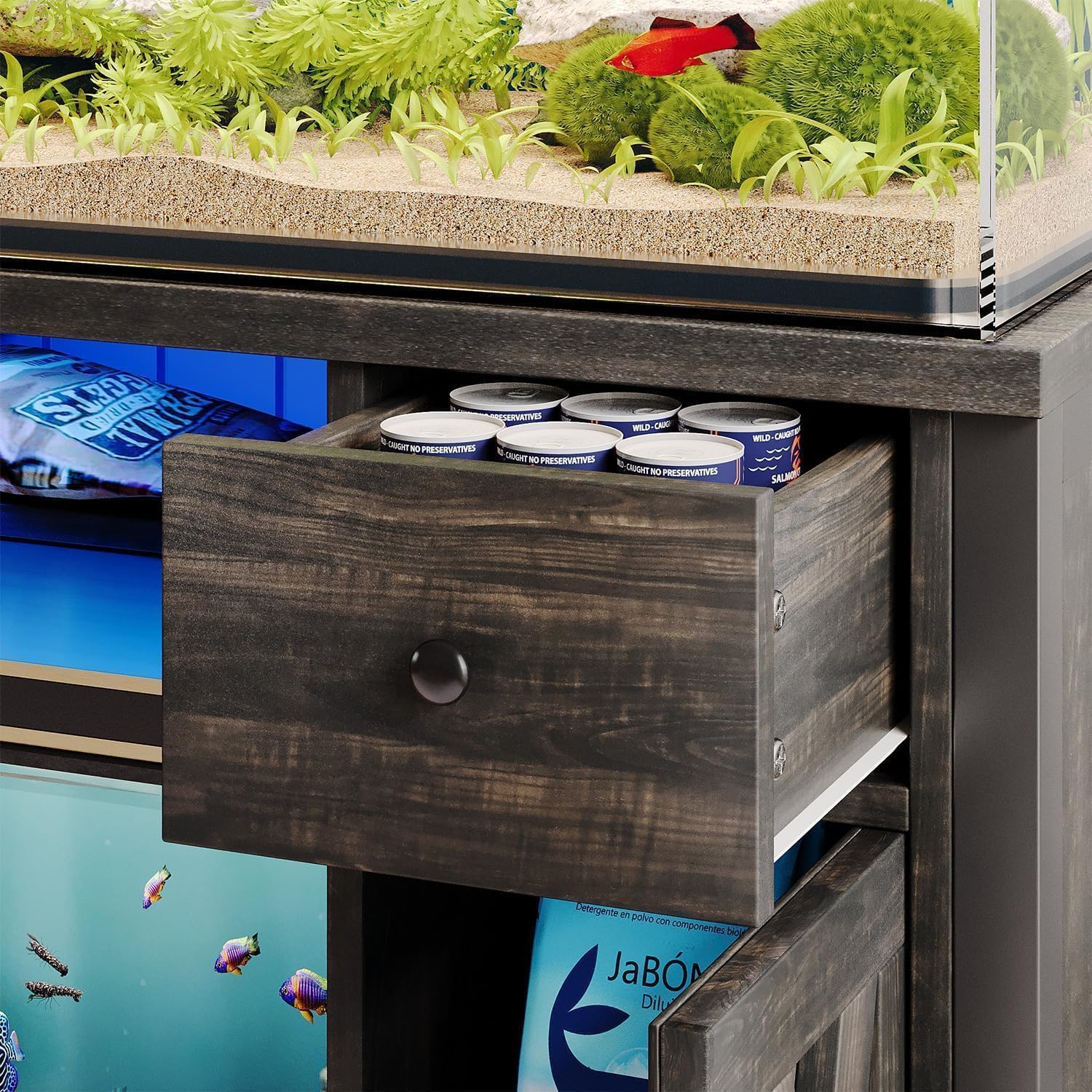 Close-up of an open drawer on the fish tank stand, showing canned fish food inside.