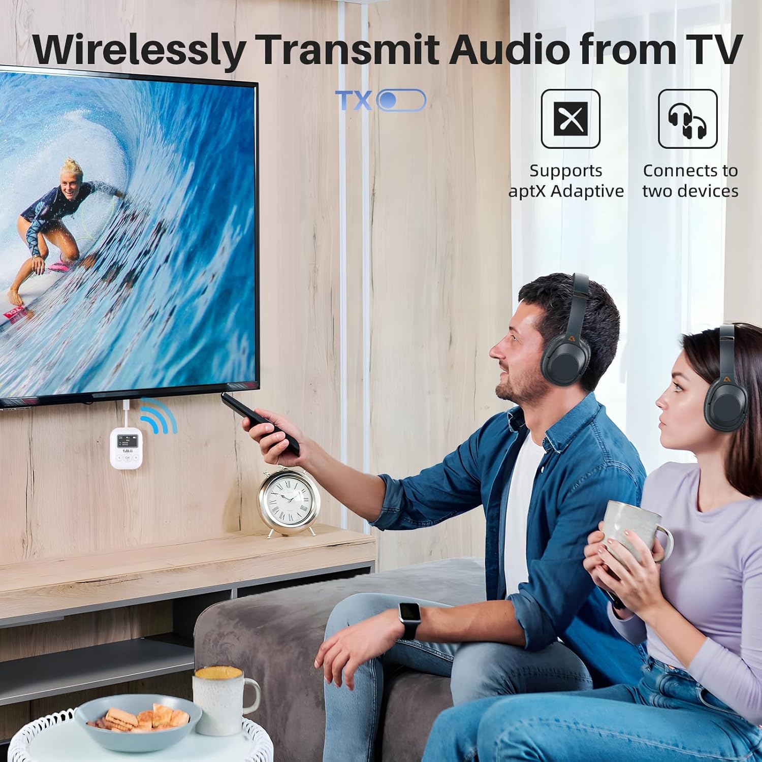 A couple watching TV with 1Mii SafeFly Min+ connected to the TV and audio streaming to their wireless headphones.