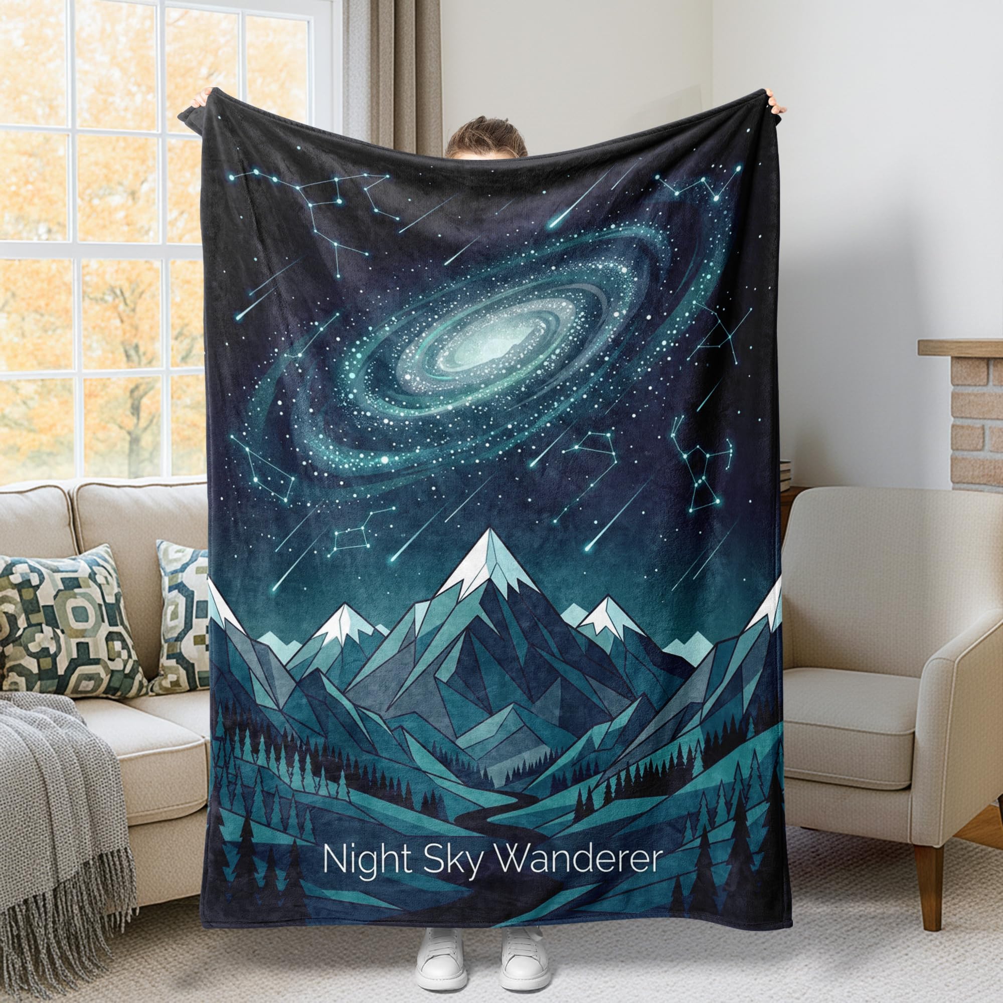 Couverture galaxie et montagnes pour vos soirées cocooning au coin du feu sur le canapé