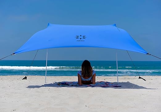 Neso Portable Beach Tent Sun Shelter with Sand Anchor - Lightweight Beach Shade Canopy - Easy Setup for Family Outings - Patented Reinforced Corners - UPF 50+ - 7 x 7ft - Periwinkle Blue Neso Portable Beach Tent Sun Shelter with Sand Anchor - Lightweight Beach Shade Canopy - Easy Setup for Family Outings - Patented Reinforced Corners - UPF 50+ - 7 x 7ft - Periwinkle Blue