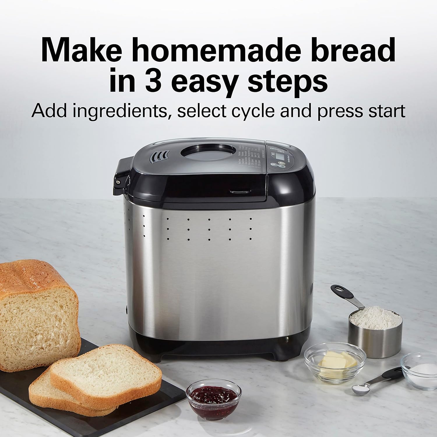Bread maker with ingredients and sliced bread