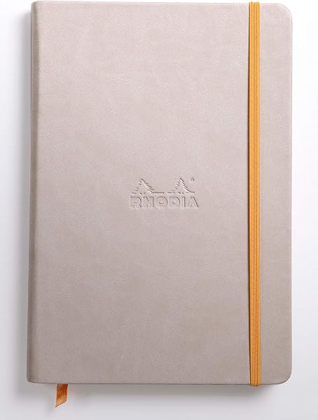 RHODIA 118742C - Carnet Rigide noir - A5 14,8 x 21 cm - Ligné - 192 pages - Papier Clairefontaine Ivoire 90 g/m² - Marque-Page, Fermeture Élastique - Couverture Simili Cuir - Collection Rhodiarama - 2