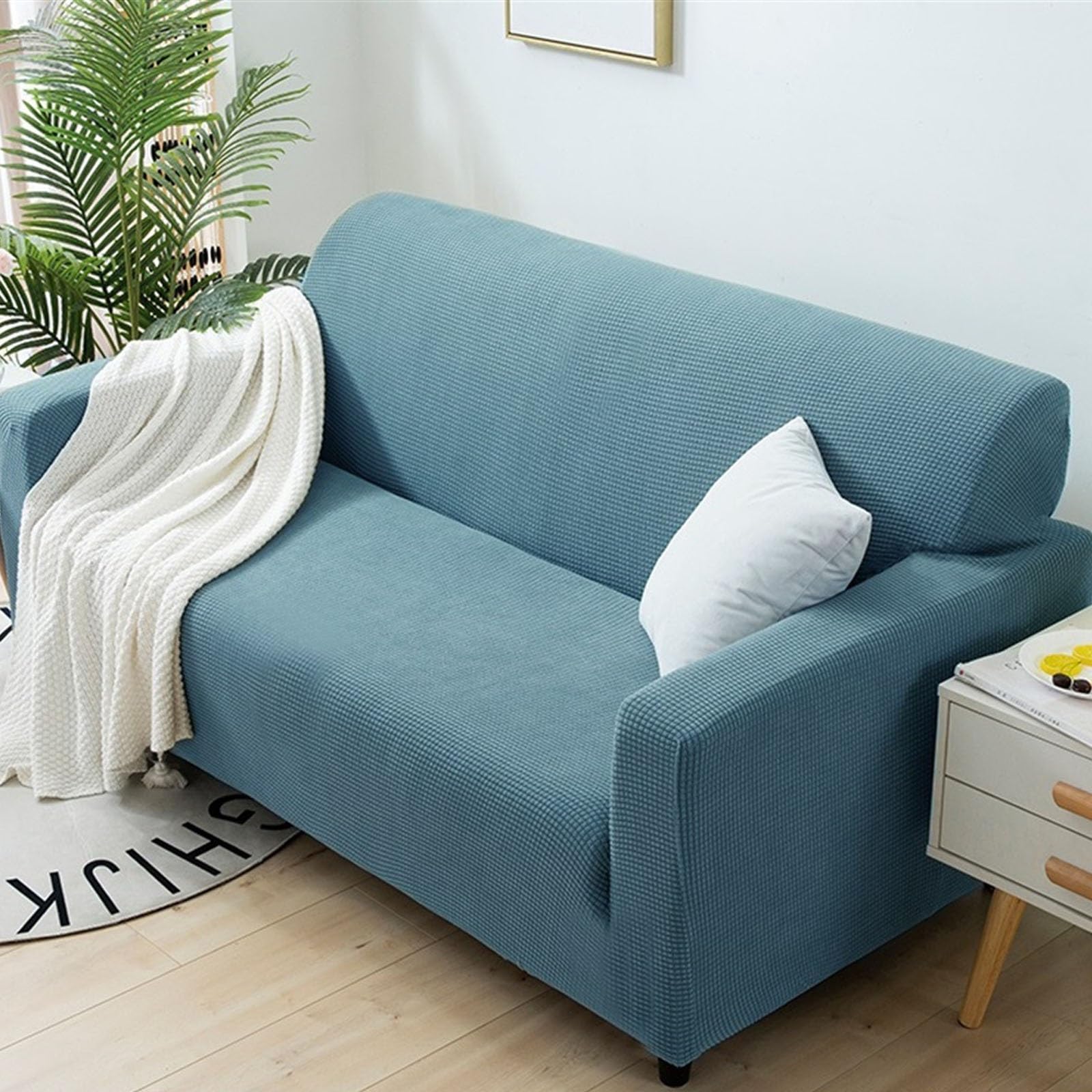 Housse de canapé élastique et antidérapante bleue pour protéger votre salon 4 saisons