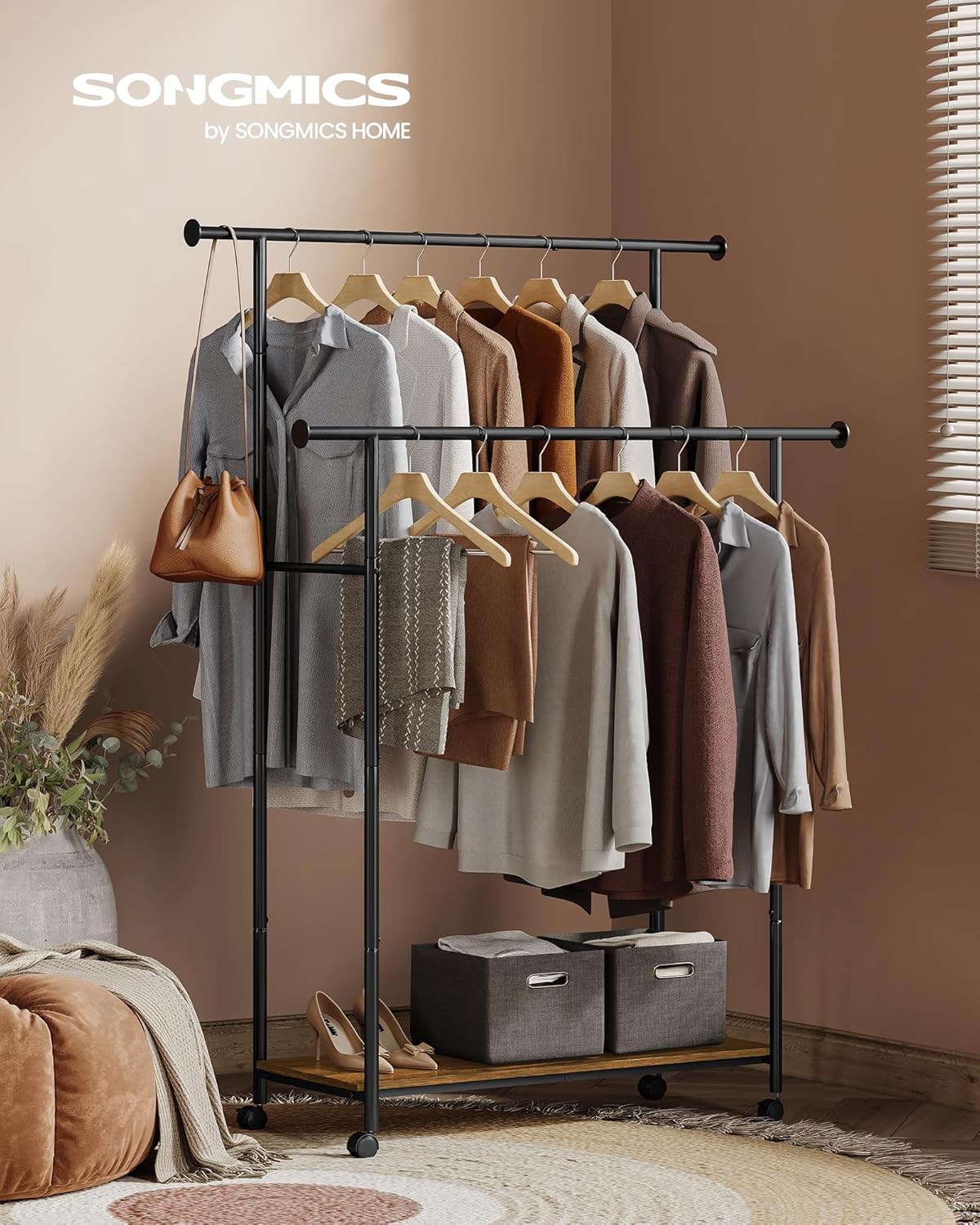 The SONGMICS HSR152B01 coat rack in a room setting, holding various garments, bags, and storage boxes on its shelf, demonstrating its practical use.