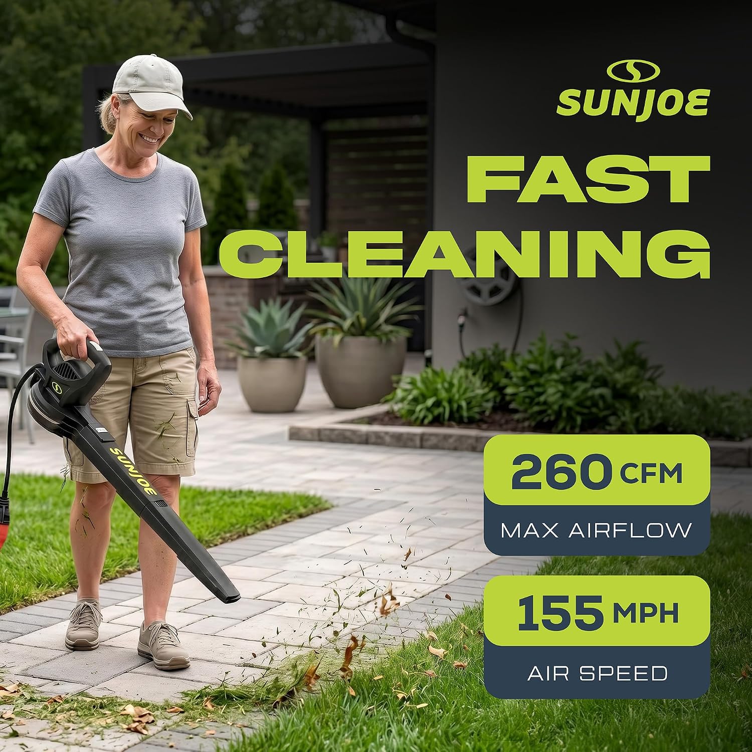 Woman using Sun Joe SBJ597E to clear grass clippings