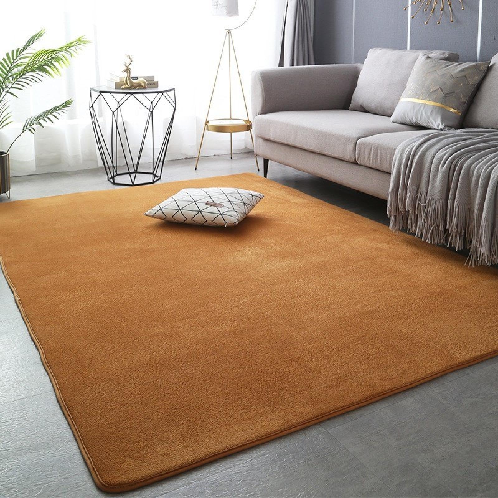 Tapis en velours corail pour salon moderne créant un coin jeu chaleureux